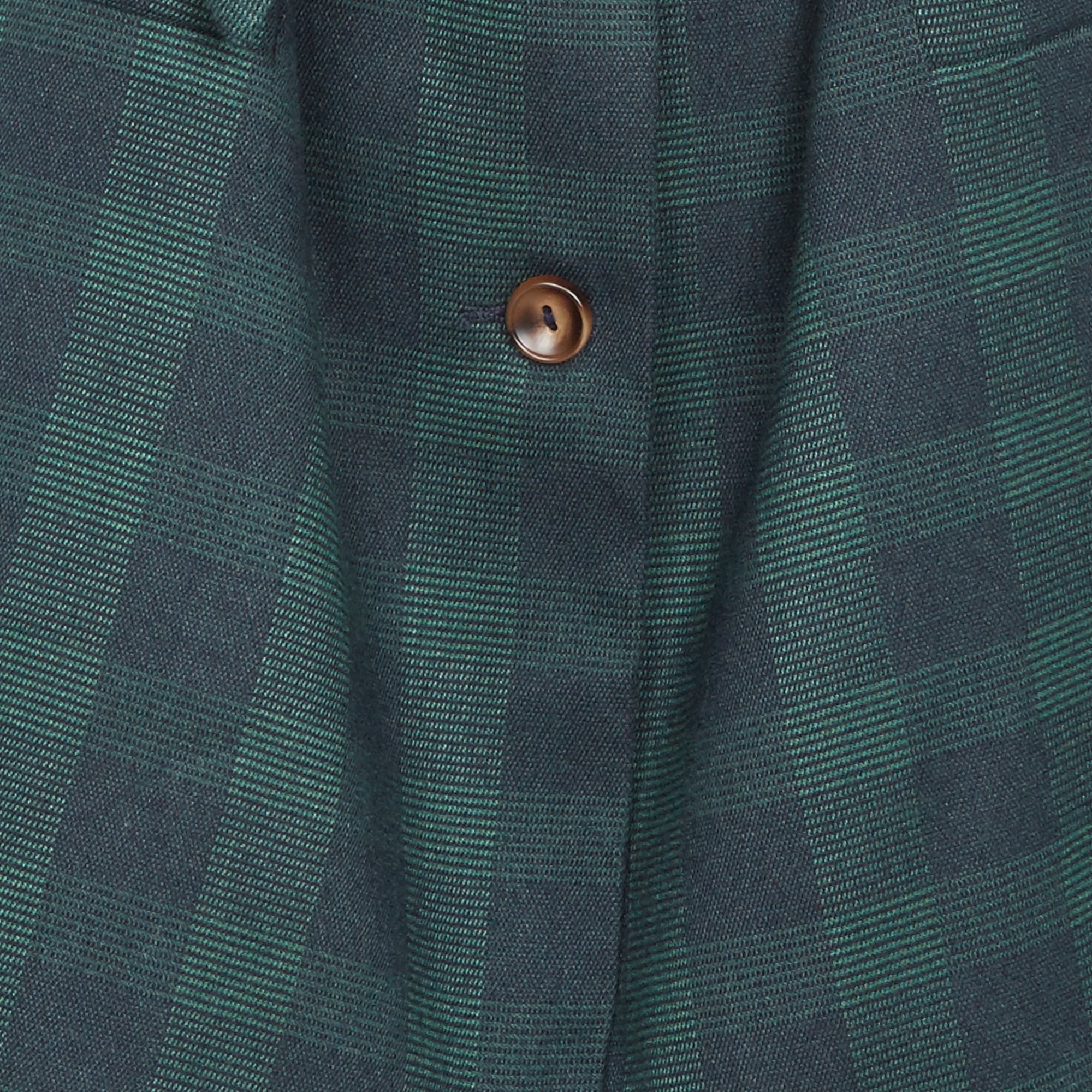 blazer on green shirt