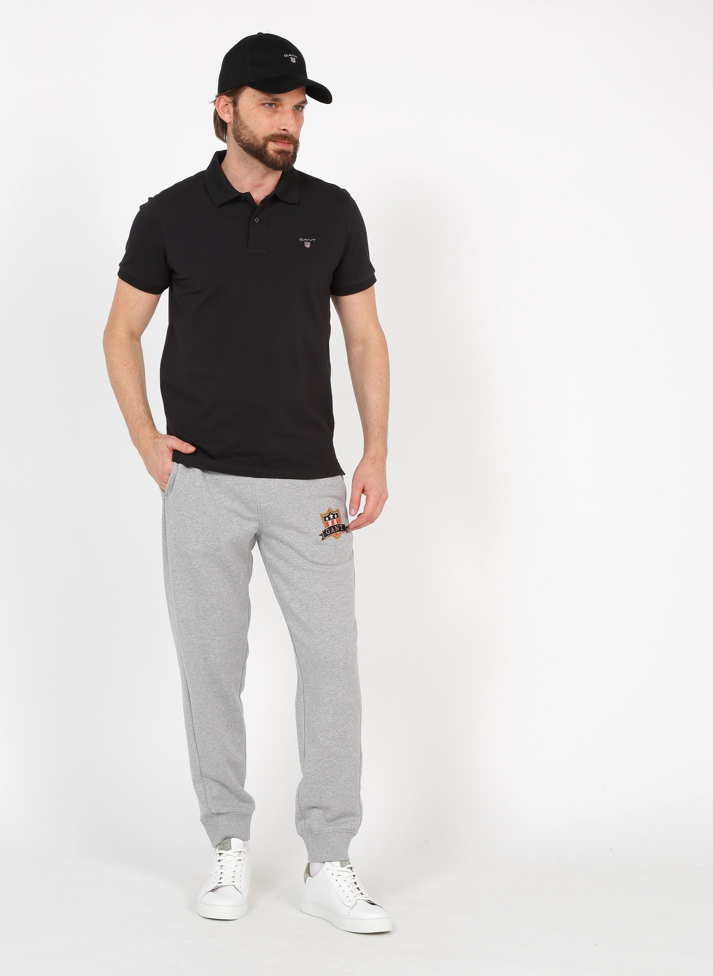 polo shirt and track pants