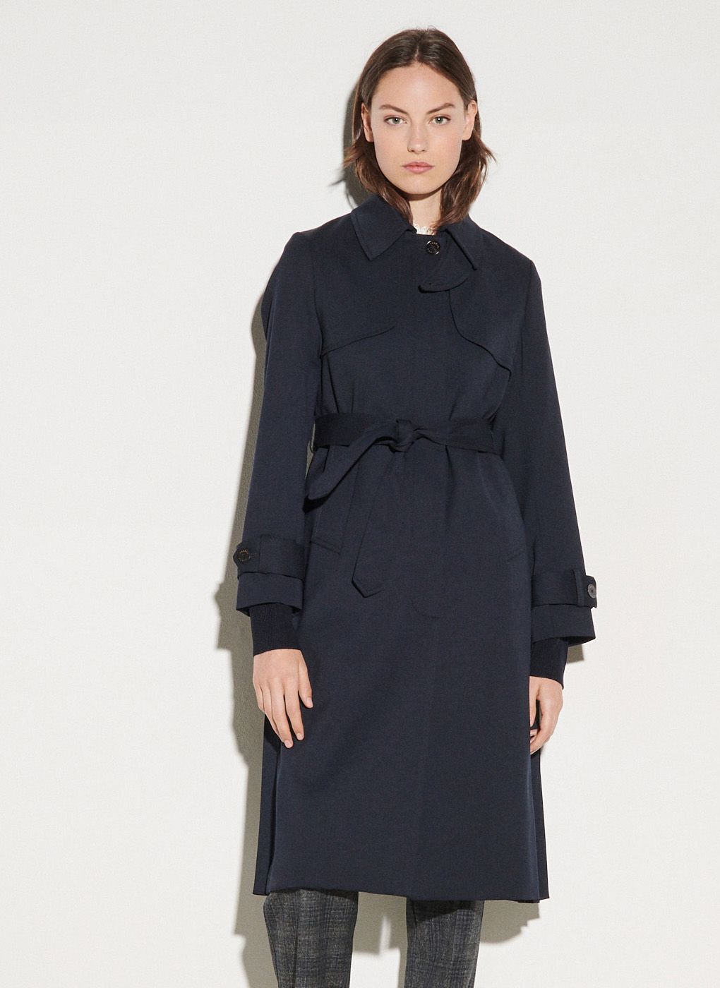 Blue Trench coat with classic collar and pleated inset at the back