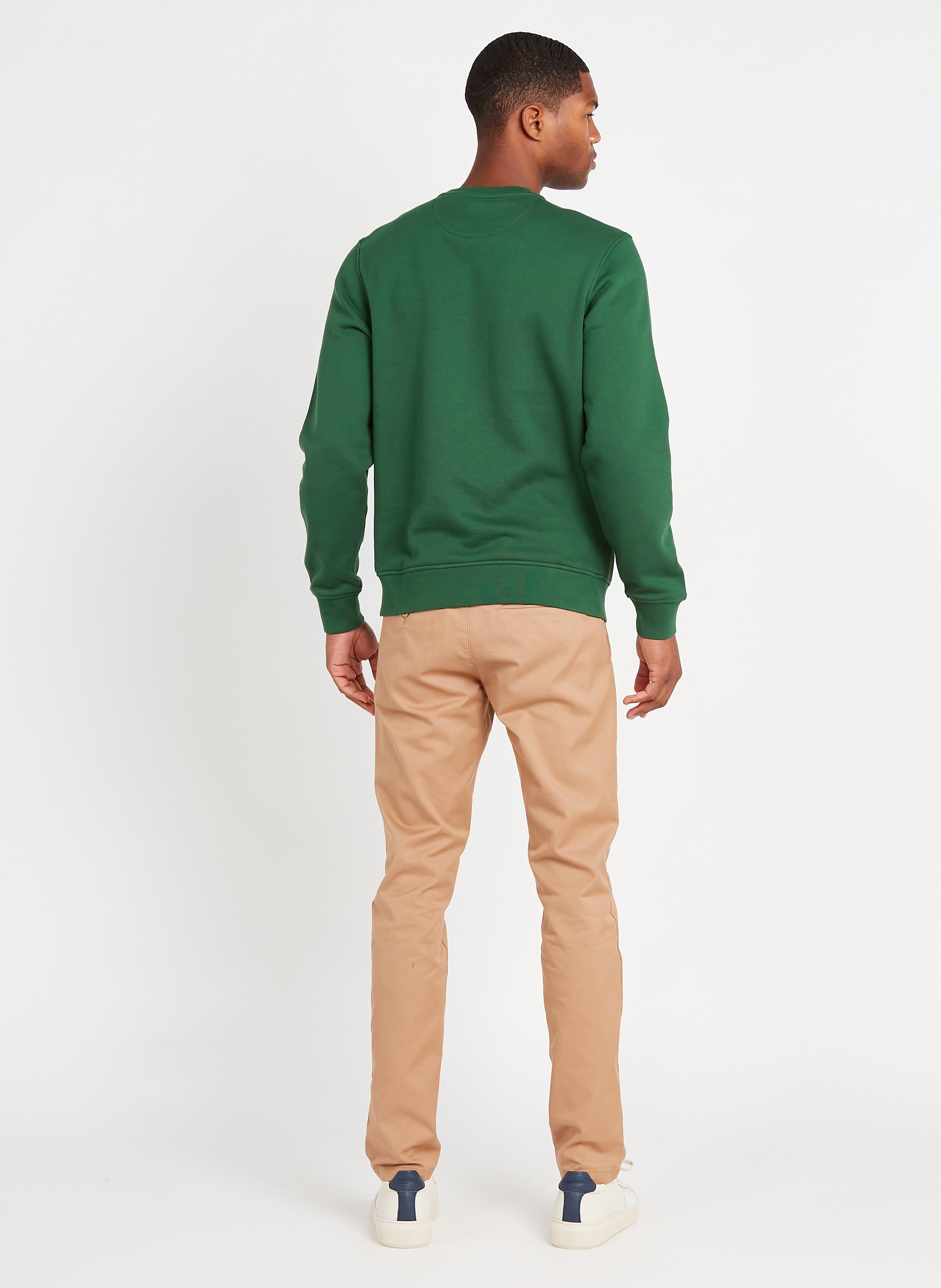 green sweater khaki pants