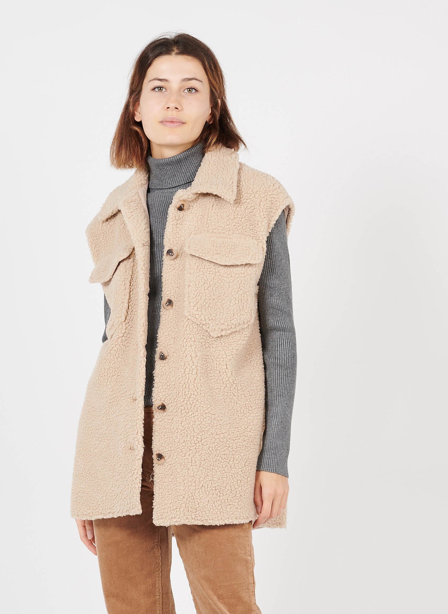 beige sleeveless jacket