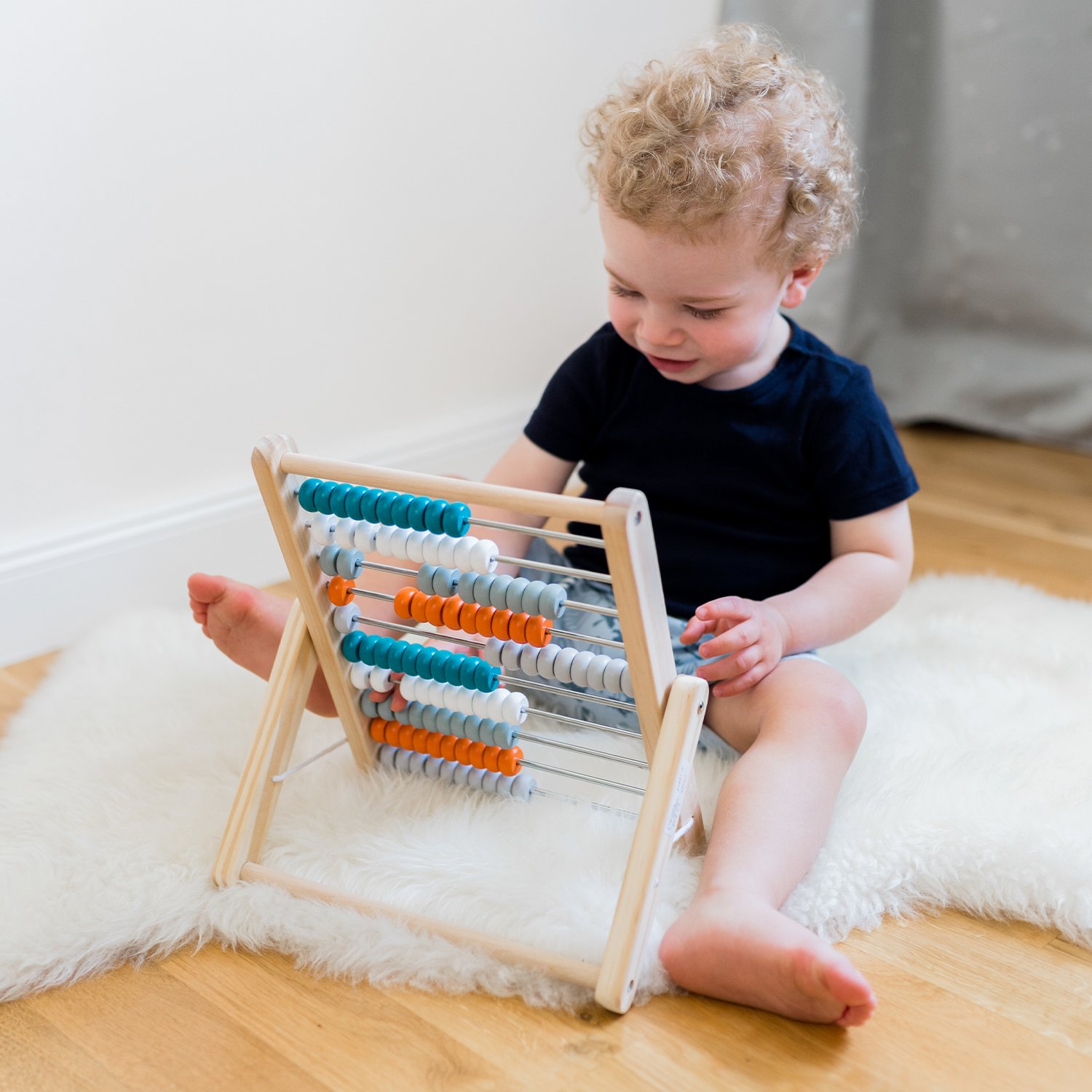 Wooden abacus with 100 coloured beads KINDSGUT White