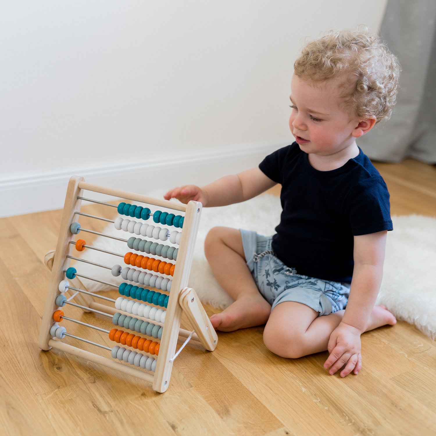 Wooden abacus with 100 coloured beads KINDSGUT White