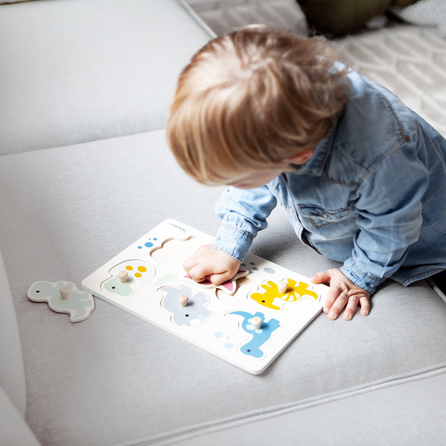 Dinosaur peg puzzle KINDSGUT Multicolored