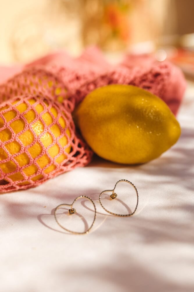 Large heart-shaped stud earrings in silver-plated. Golden