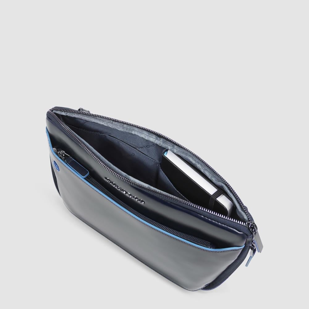 Flat expandable bum bag with repositionable shoulder strap attachments and pocket for airpods® PIQUADRO Blue