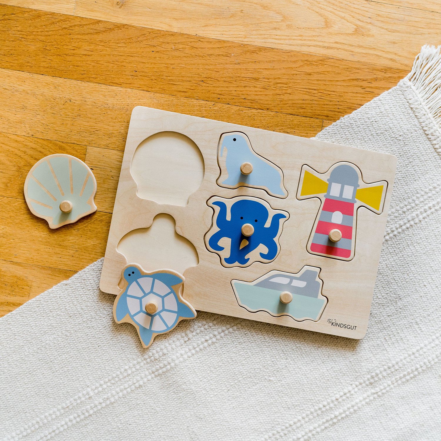 Wooden ocean peg puzzle KINDSGUT Blue