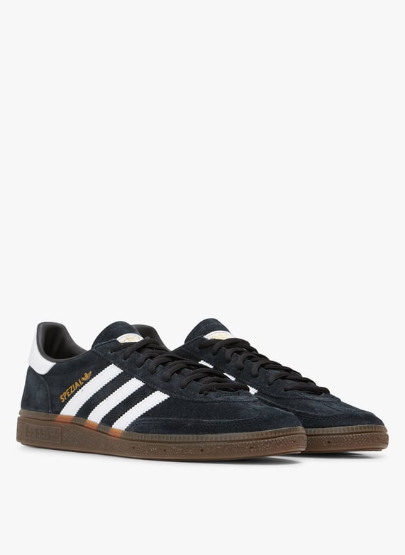 Lage leren sneakers met veters Zwart