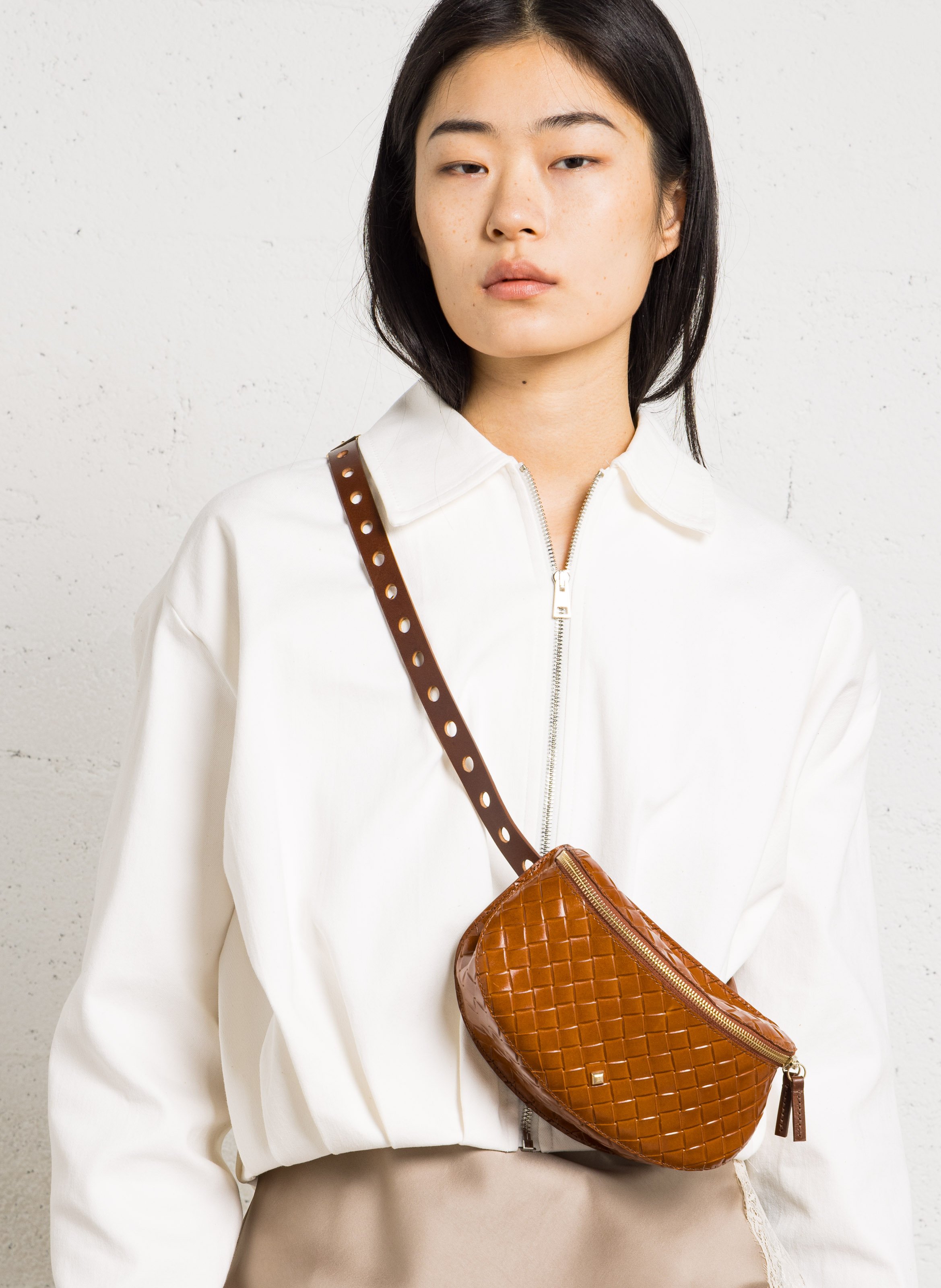 Pochette en cuir tressé HERBERT FRERE SOEUR Marron