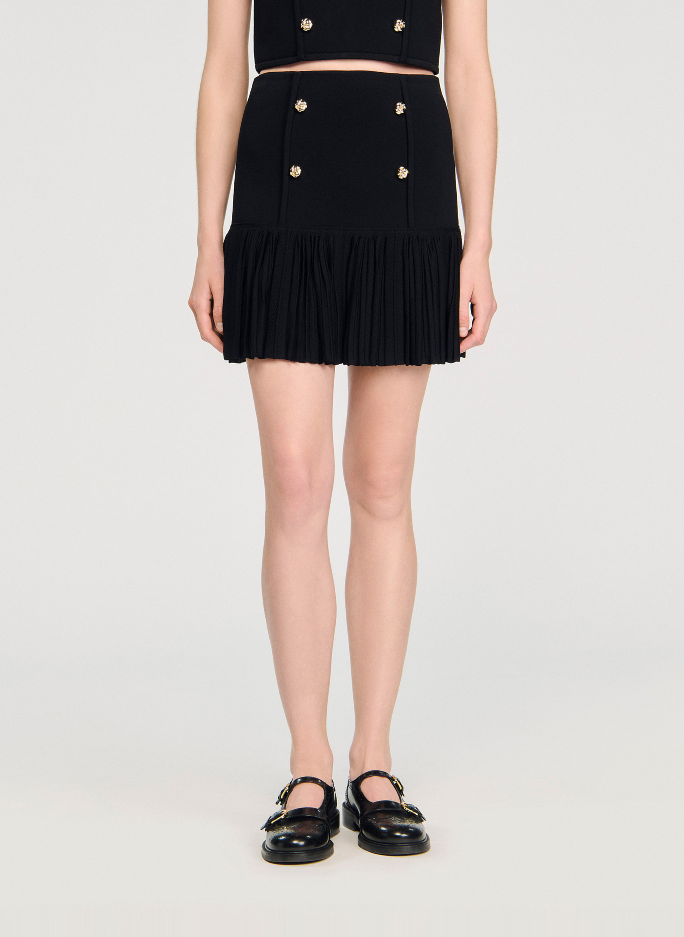 Jupe courte plissée en maille SANDRO Noir