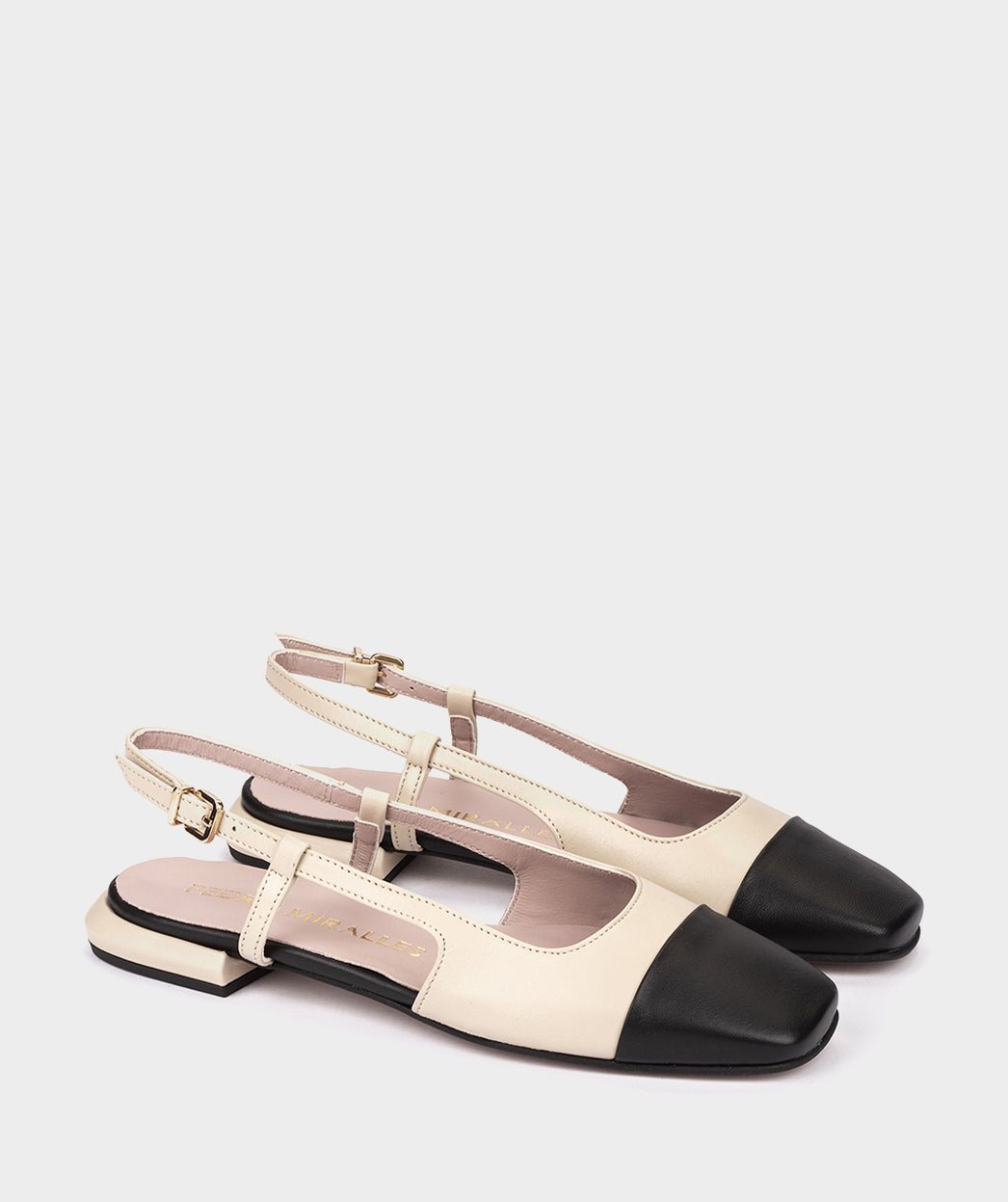 Beige leather cut-out ballerina flats with black toe. PEDRO MIRALLES Beige