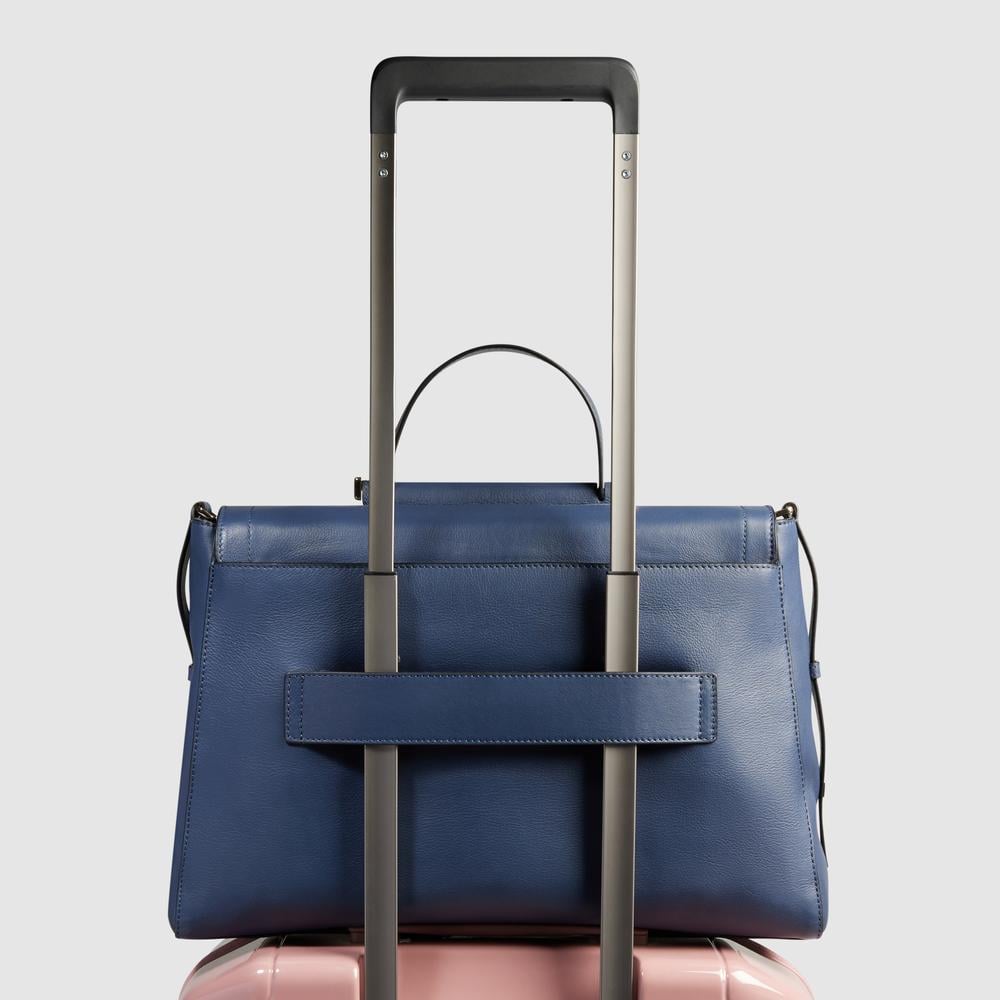 Women's leather satchel bag with laptop compartment, shockproof protection, and RFID shielding PIQUADRO Blue