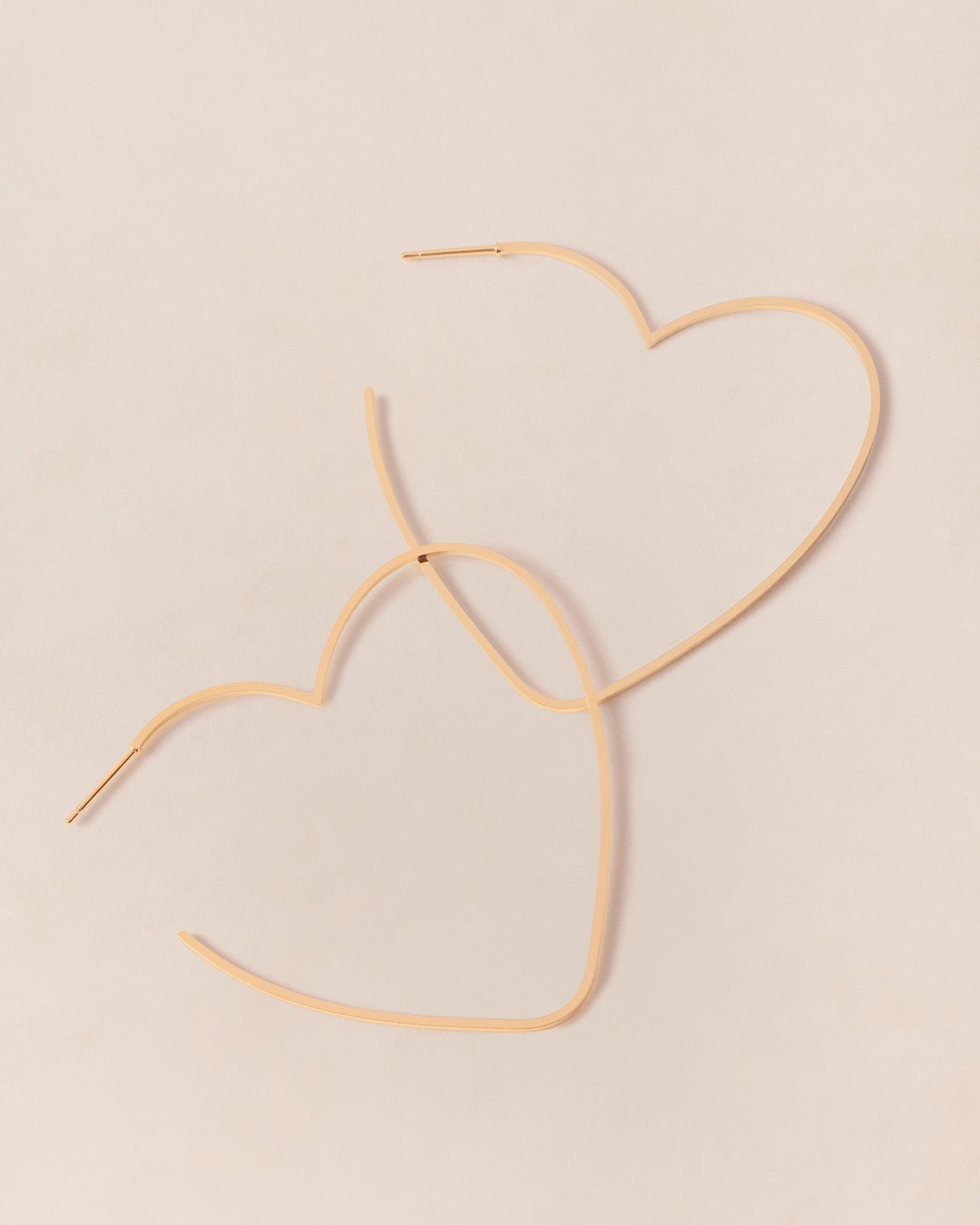 Heart-shaped golden hoop earrings EMOI EMOI Golden