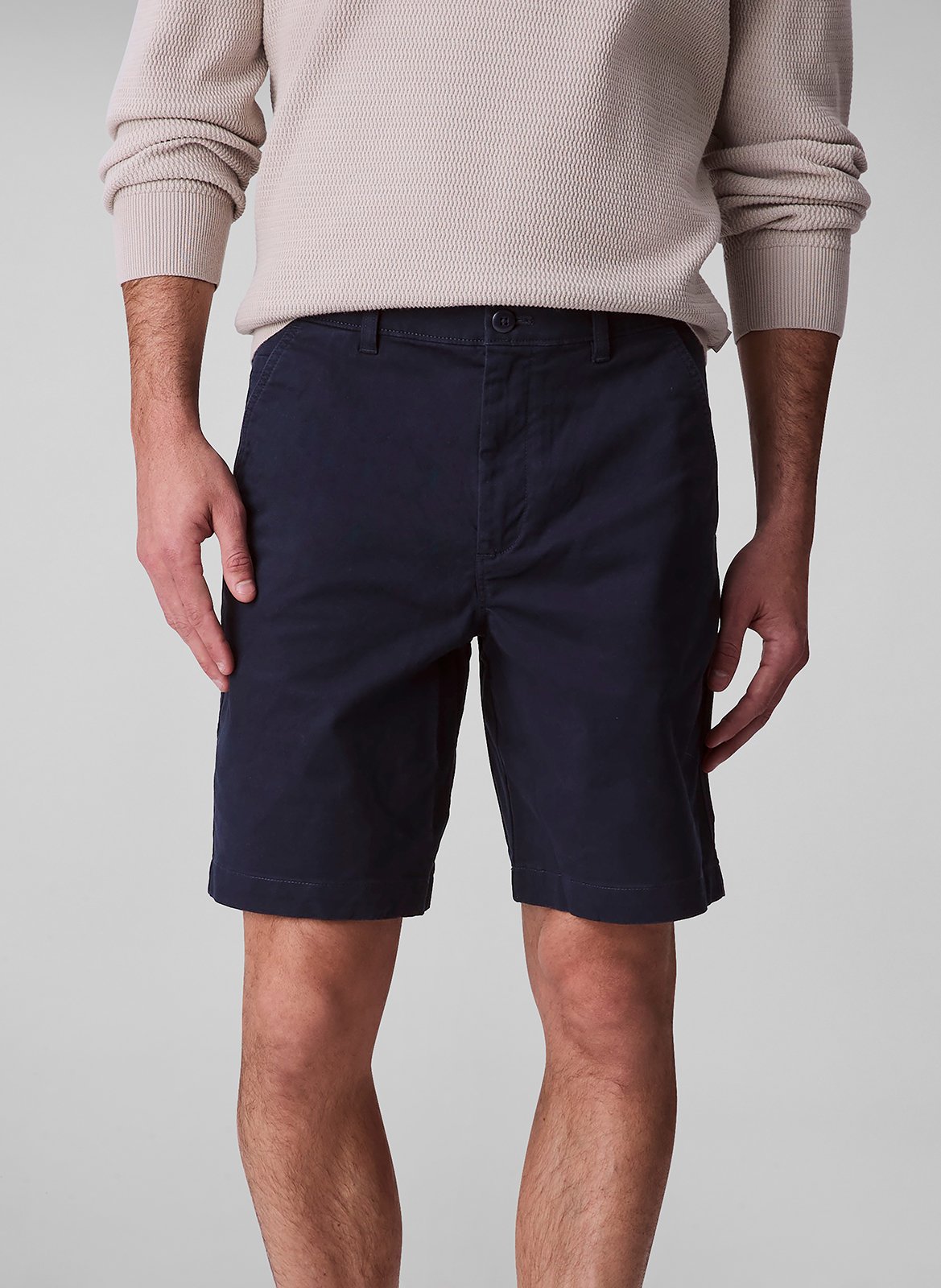 Short solid color chino in blended cotton. CALVIN KLEIN