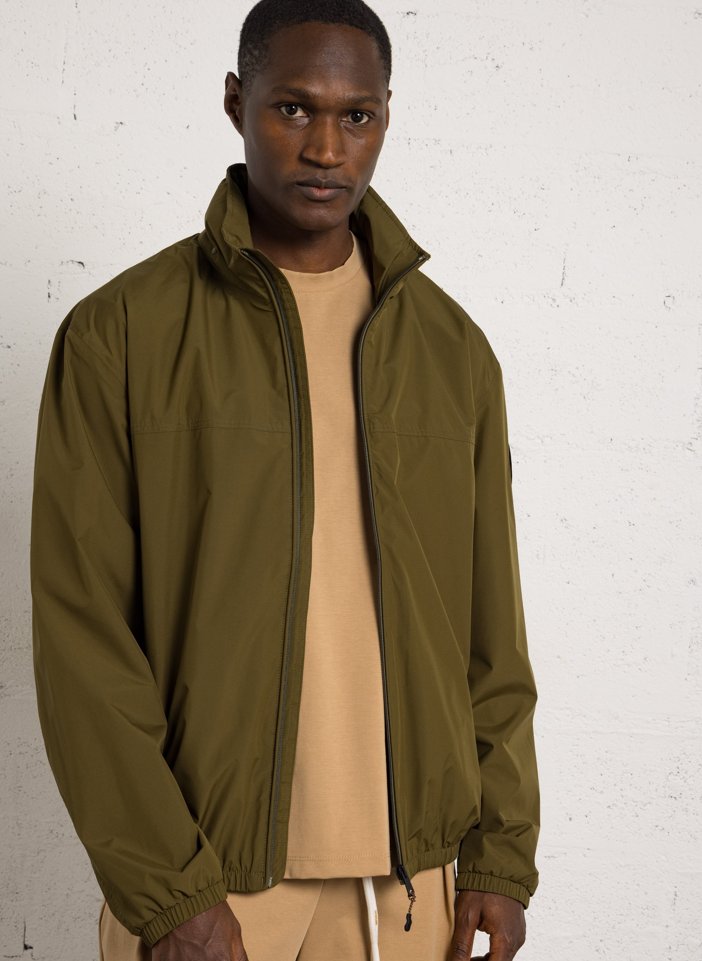 Buttoned and zipped high-neck fitted raincoat NAPAPIJRI Green