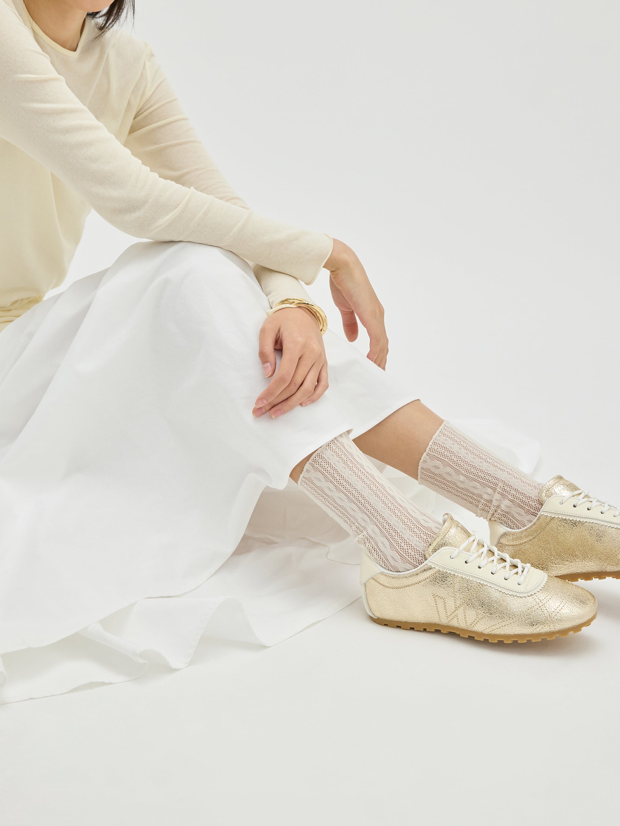 Sneakers with monogram sewn on a thin grooved sole VANESSA WU Golden