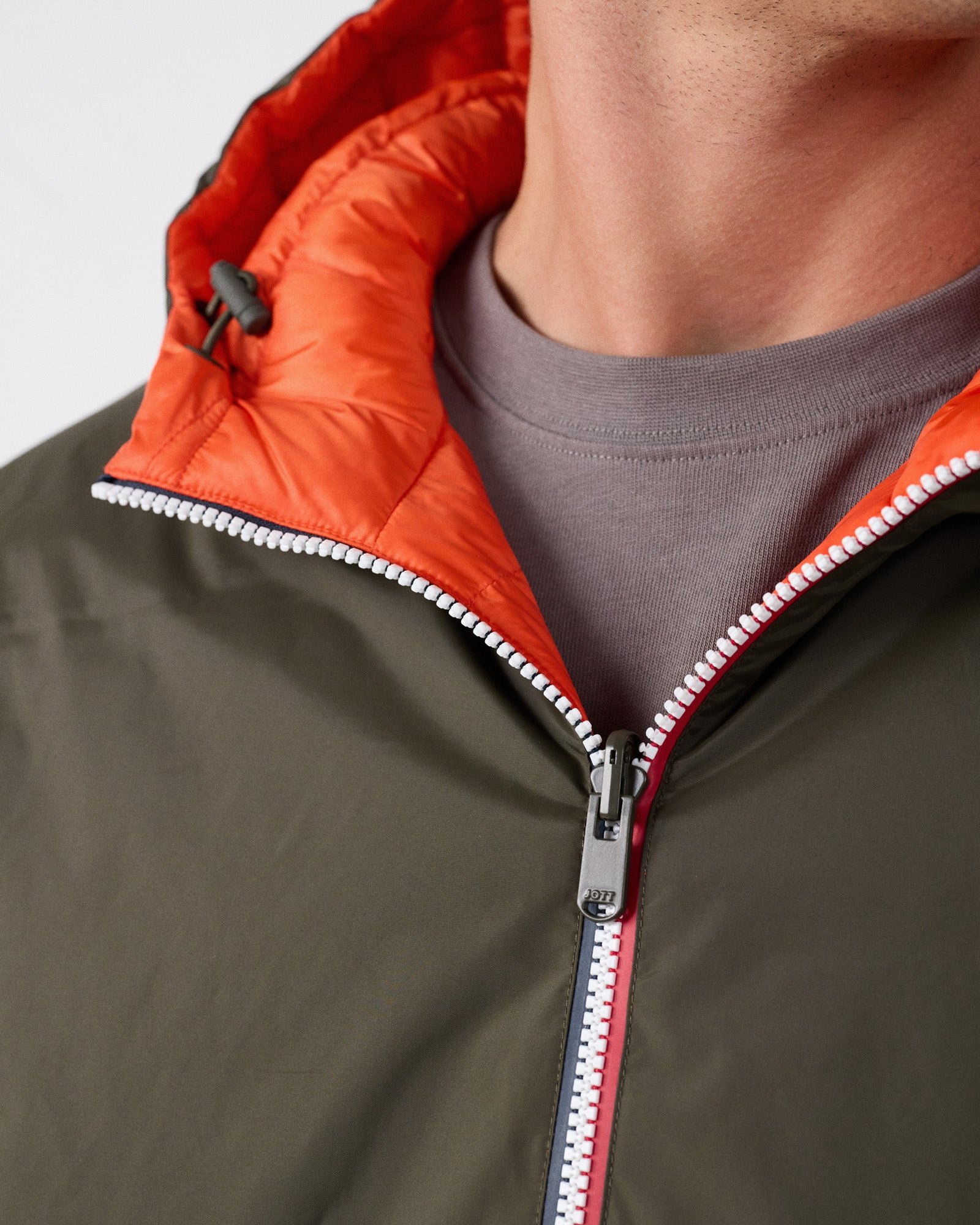 Reversible long jacket in army green/fire red. JOTT Green