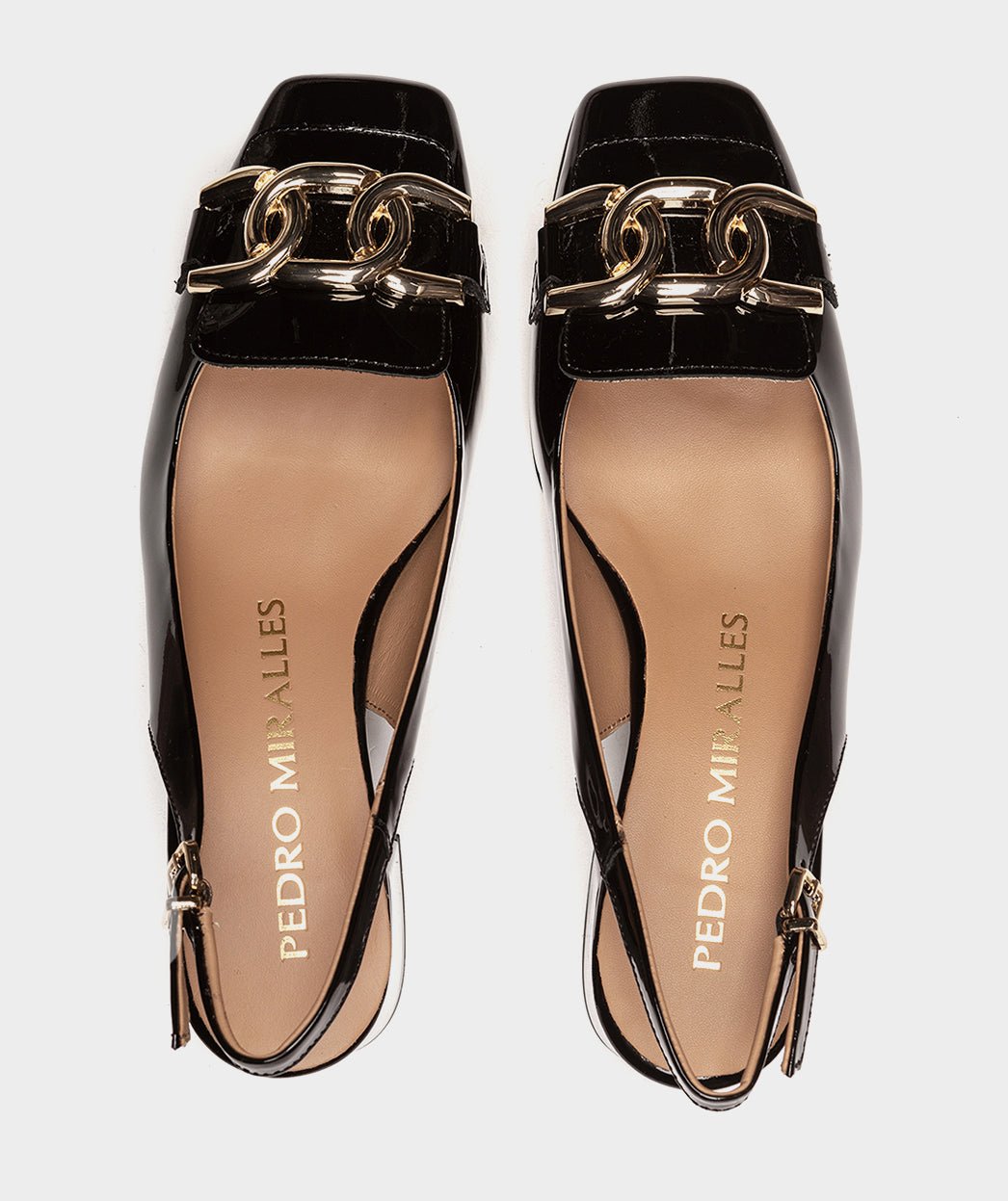 <p>Black patent leather high-heeled shoes, open back.</p> PEDRO MIRALLES Black