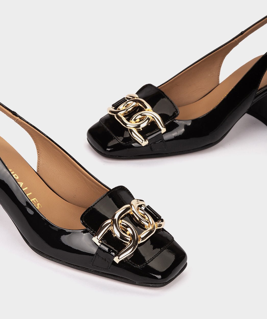 <p>Black patent leather high-heeled shoes, open back.</p> PEDRO MIRALLES Black