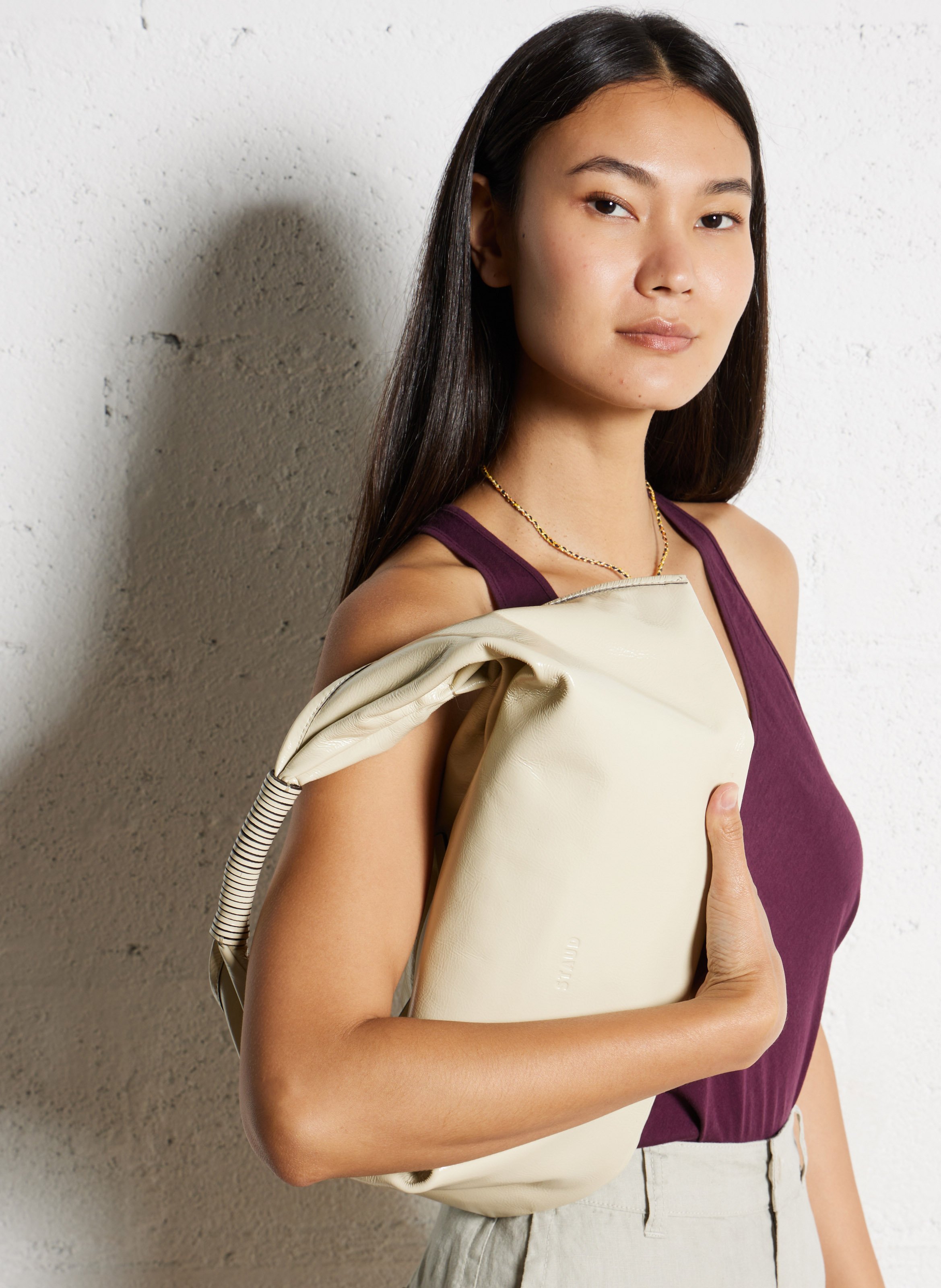 Leather clutch bag STAUD White