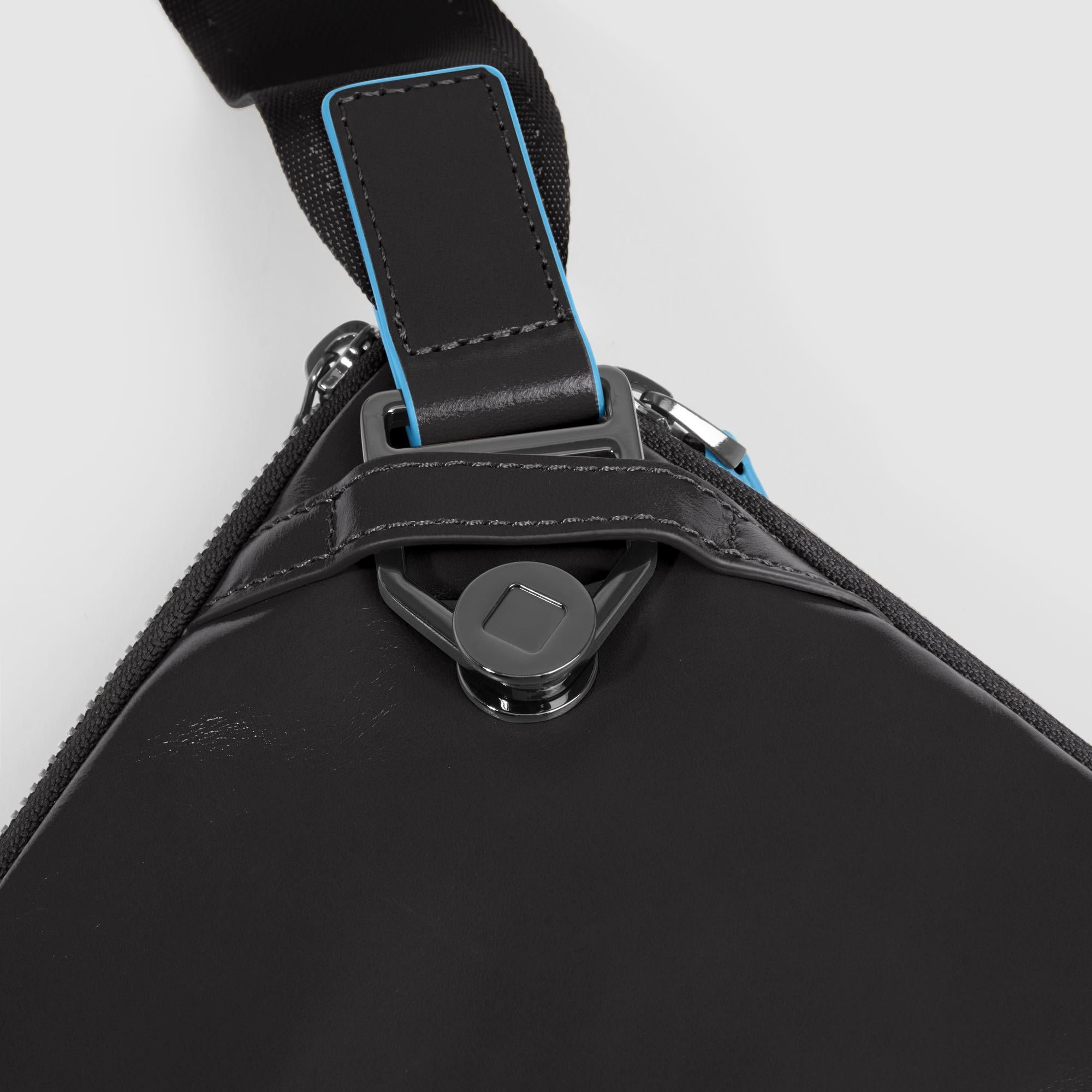 Flat expandable bum bag with repositionable shoulder strap attachments and pocket for airpods® Black