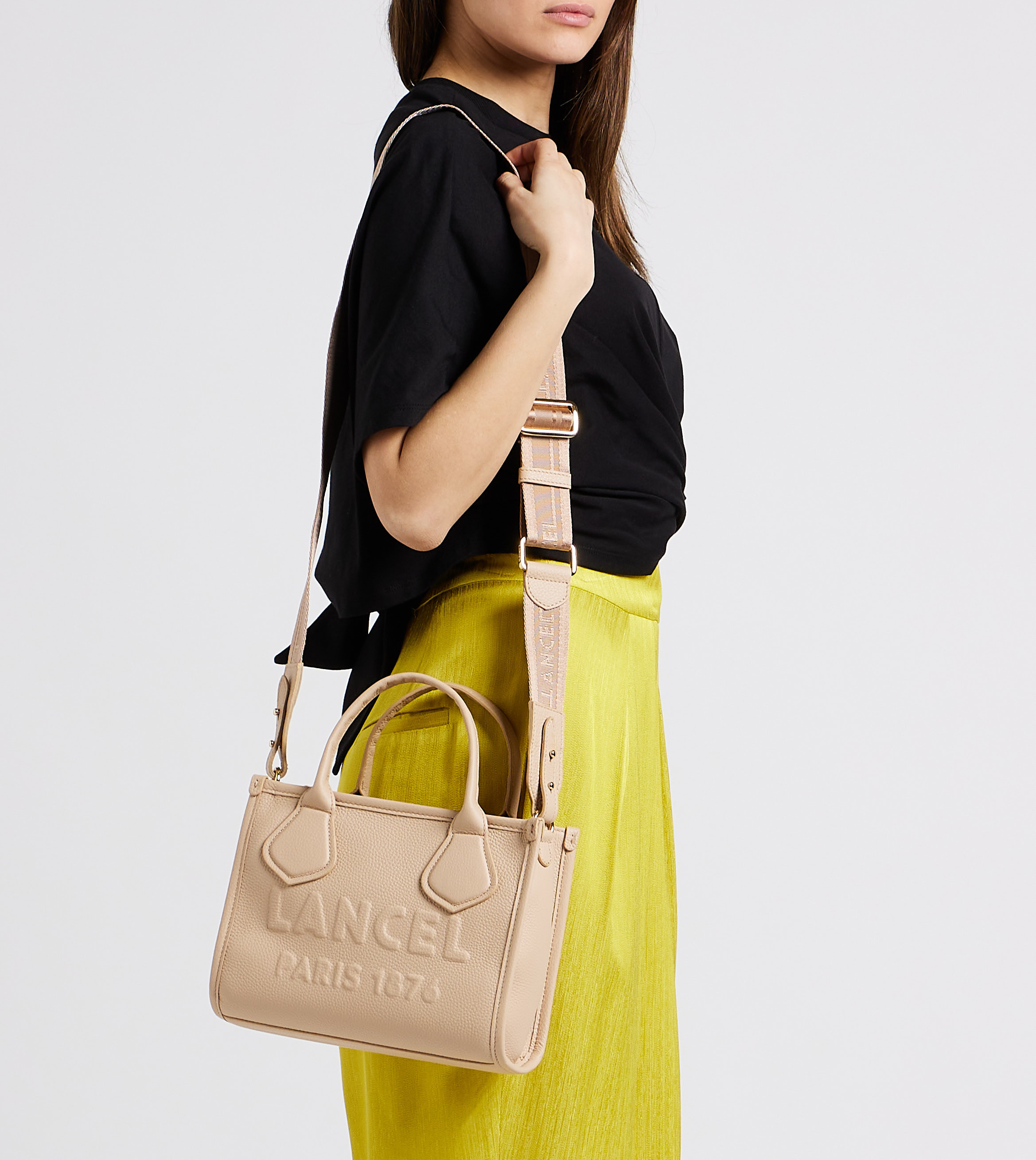 Embossed logo grained leather handbag LANCEL Beige