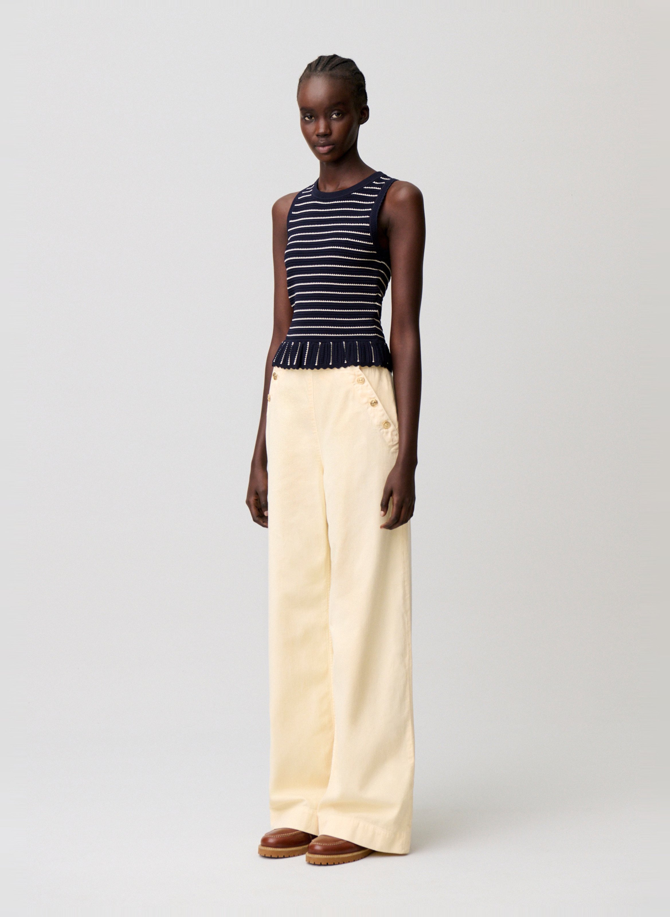 Wijde broek met denim overgooier. CLAUDIE PIERLOT Geel