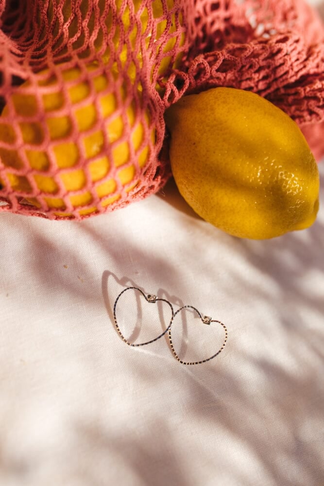 Large heart-shaped stud earrings in silver-plated. Silver