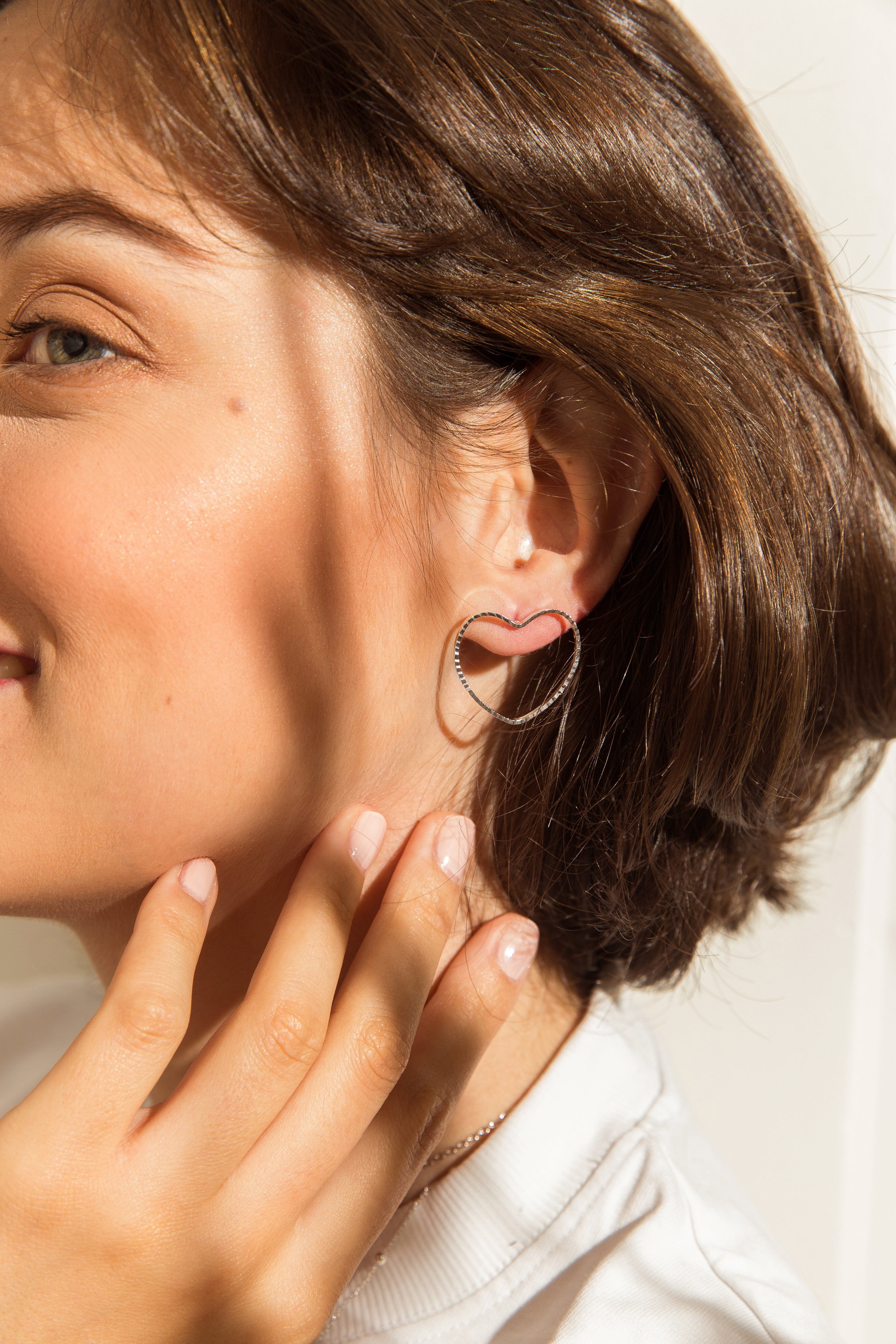 Large heart-shaped stud earrings in silver-plated. Silver
