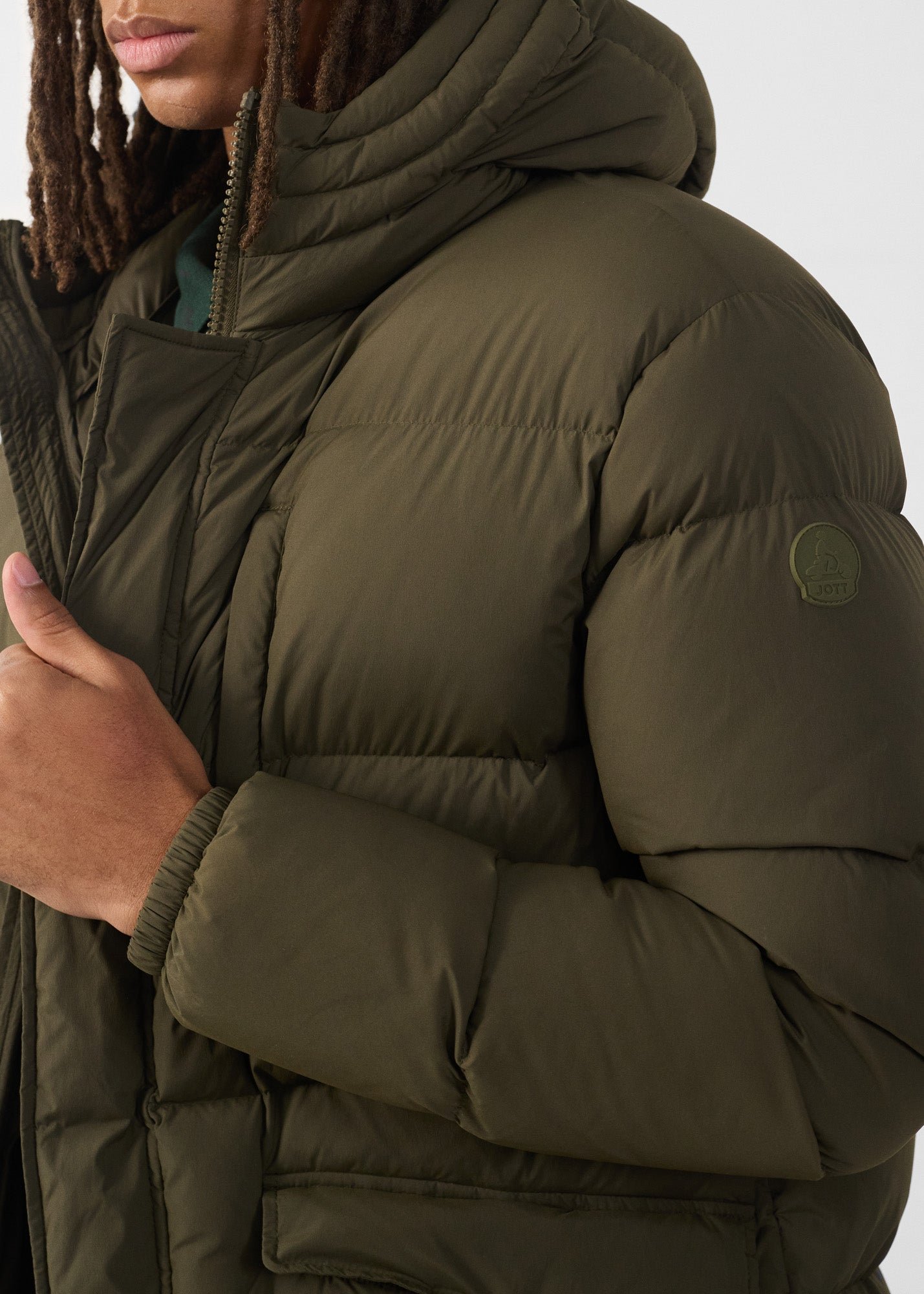 Mid-length stretch cold weather puffer coat by Scott. JOTT Green