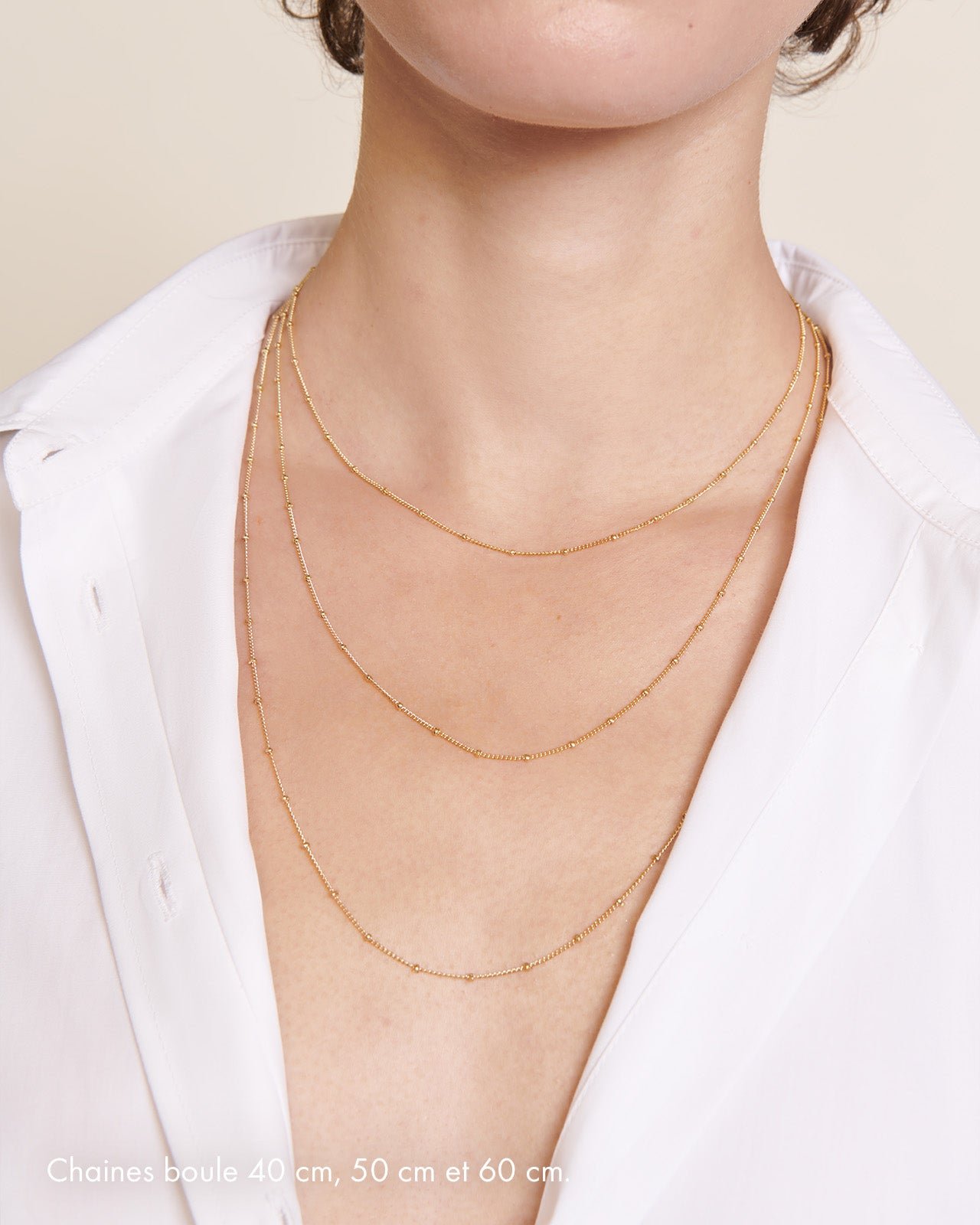 The necklace with gold plated 24-carat ball chain. EMOI EMOI Golden