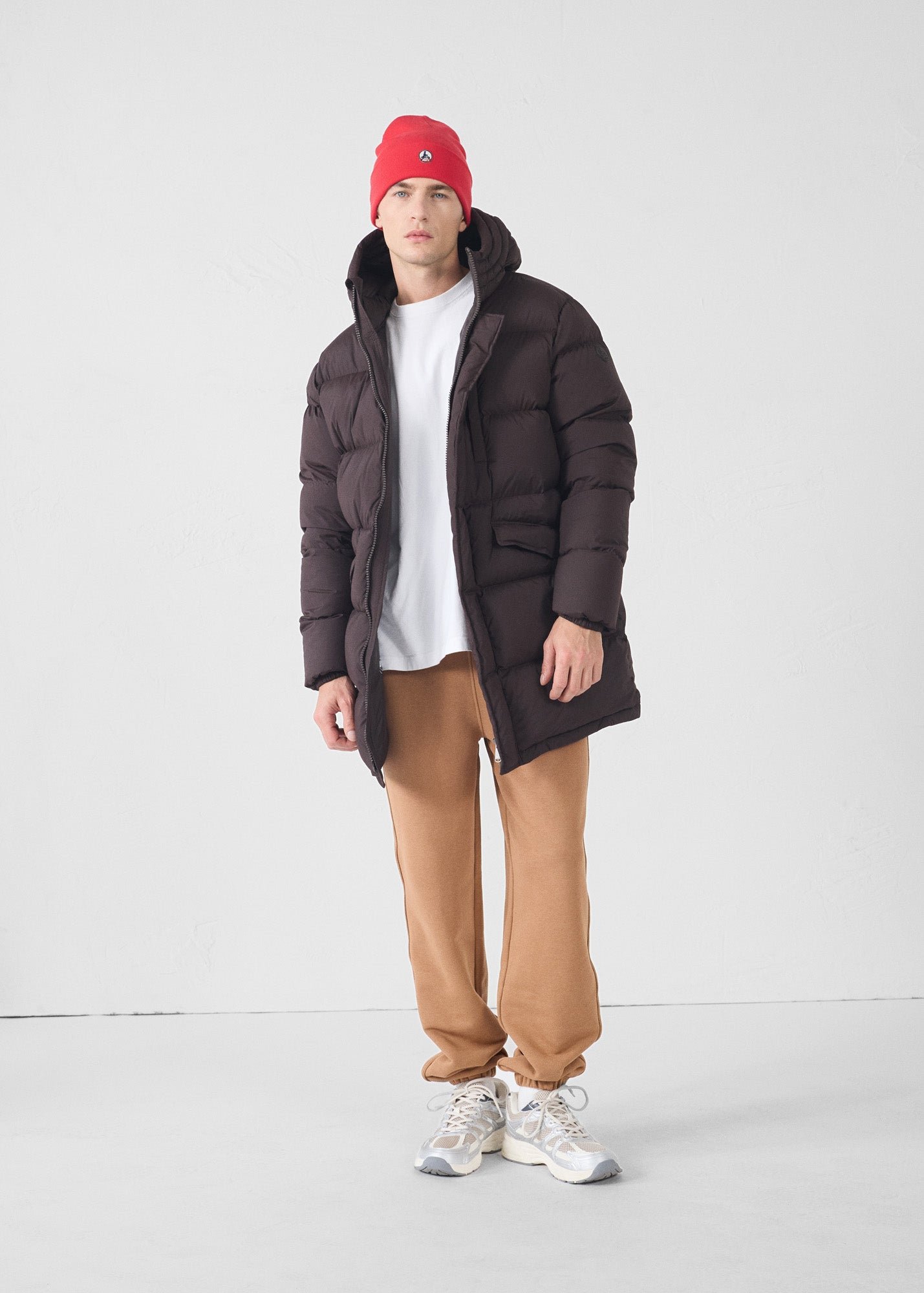 Black stretch mid-length extreme cold down jacket by Scott. JOTT Brown