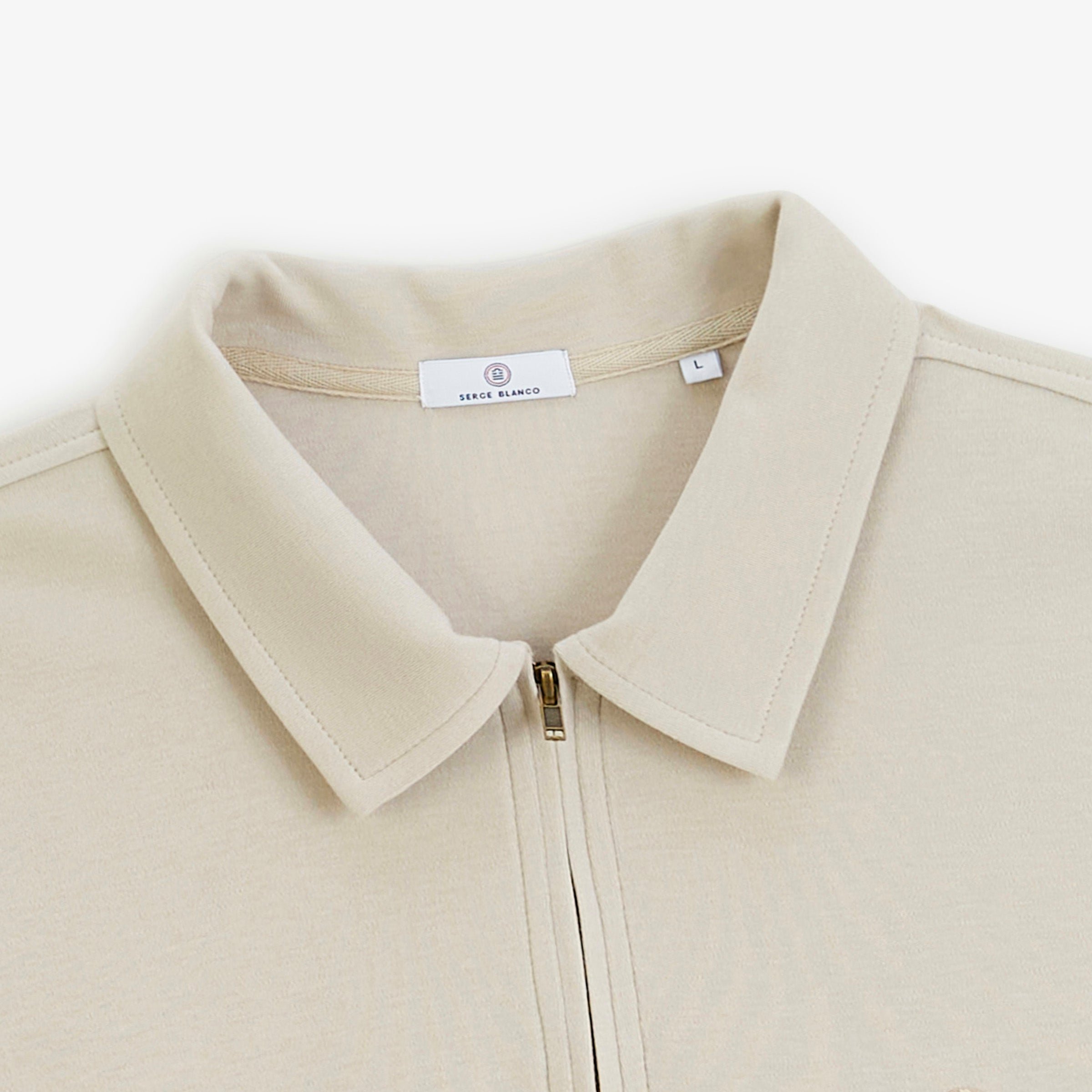 Zip-up long-sleeve polo in beige travertine interlock cotton. SERGE BLANCO Beige
