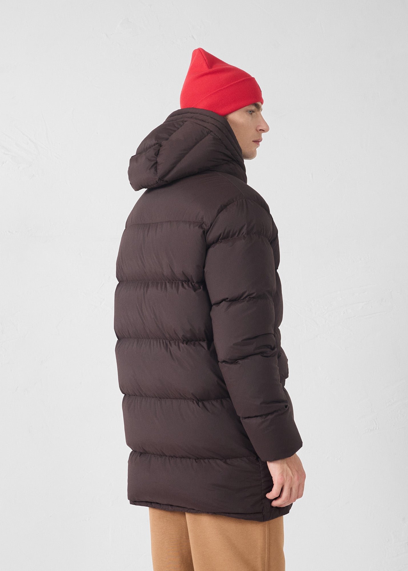 Black stretch mid-length extreme cold down jacket by Scott. JOTT Brown
