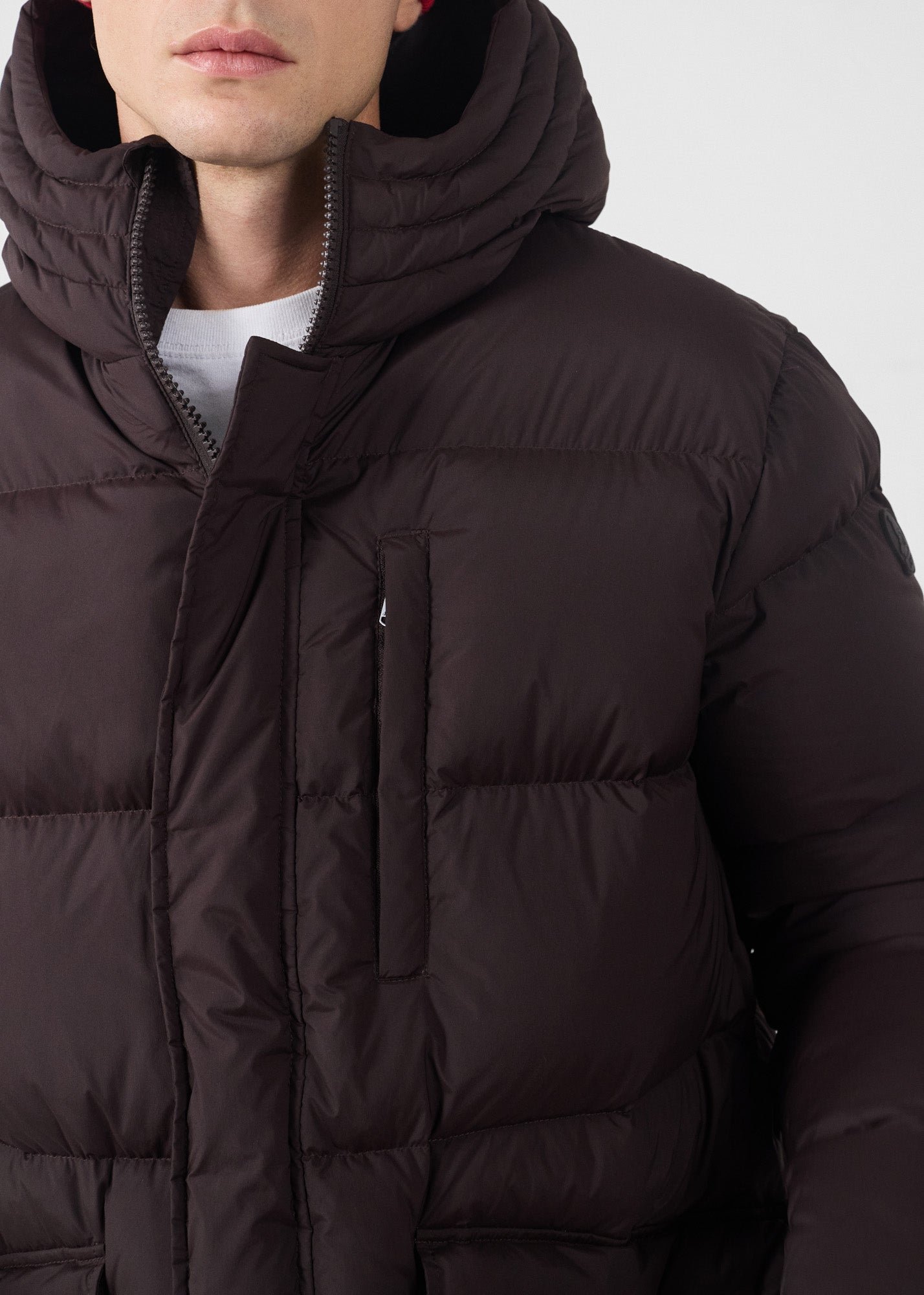 Black stretch mid-length extreme cold down jacket by Scott. JOTT Brown