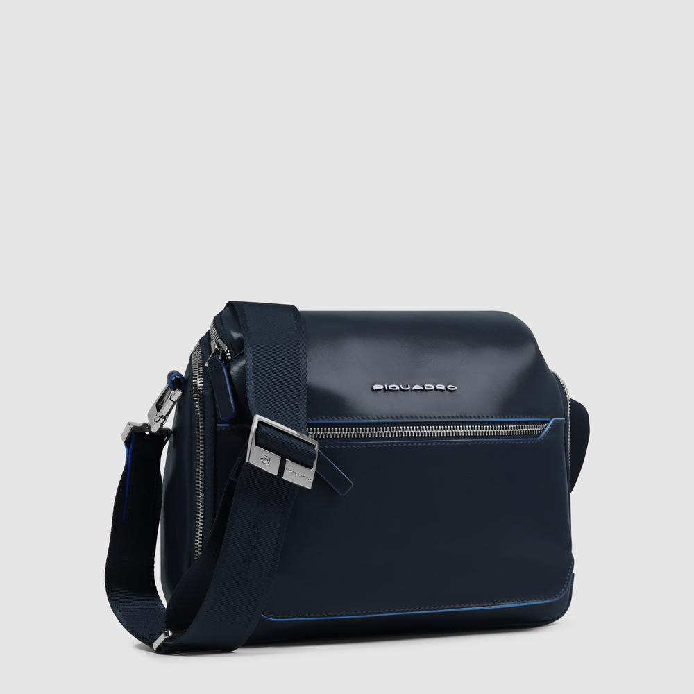 Customizable crossbody bag for iPad® mini with pockets for mouse and airpods and RFID protection. PIQUADRO Blue