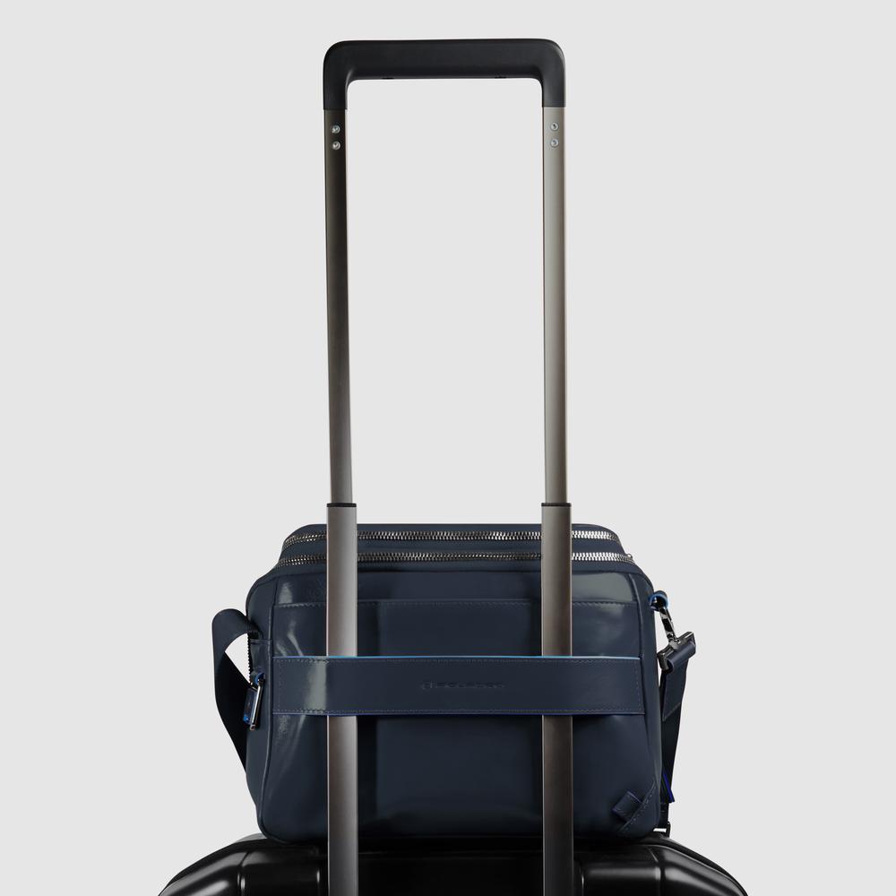 Customizable crossbody bag for iPad® mini with pockets for mouse and airpods and RFID protection. PIQUADRO Blue