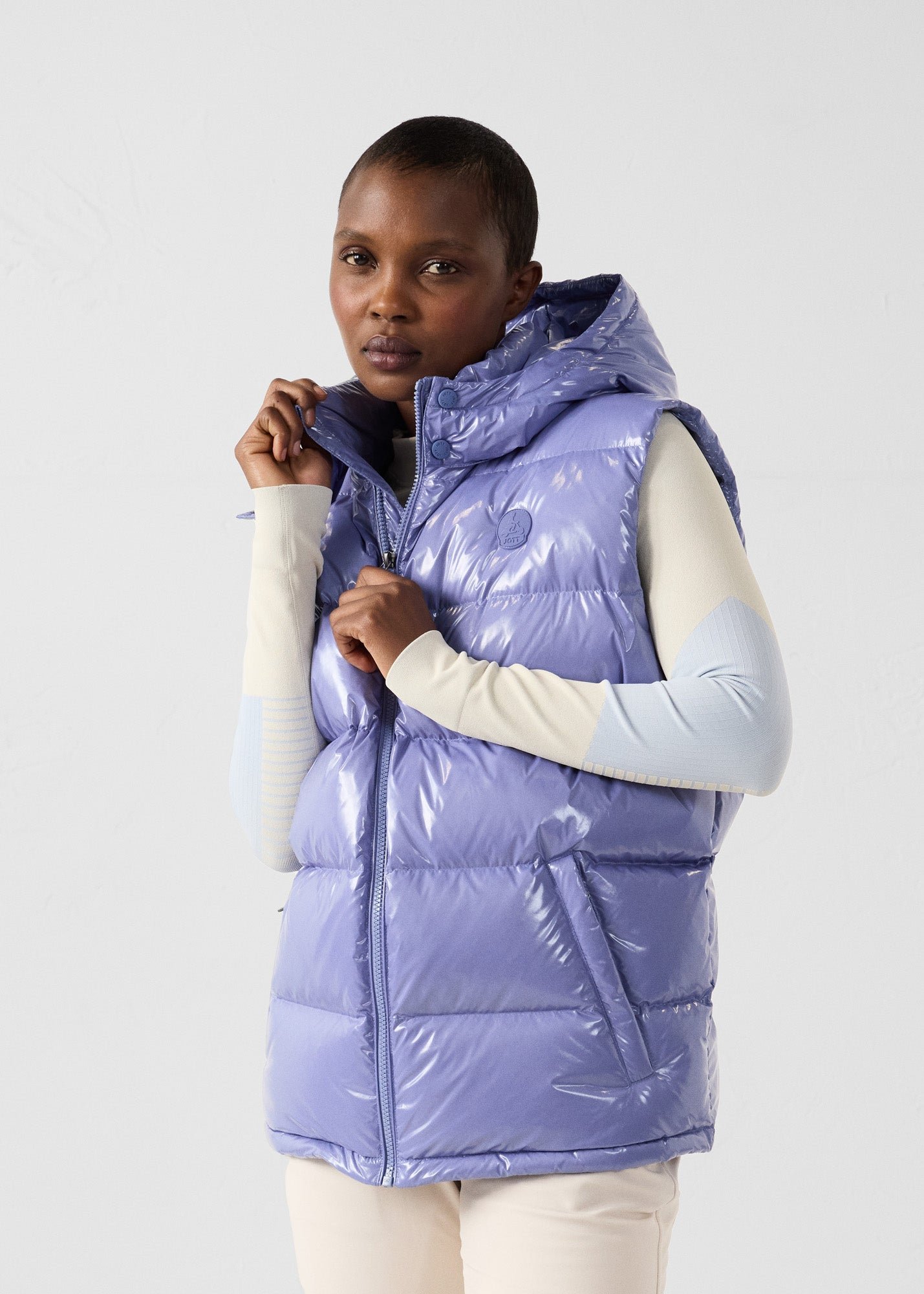Padded sleeveless down jacket for extreme cold weather. JOTT Pink