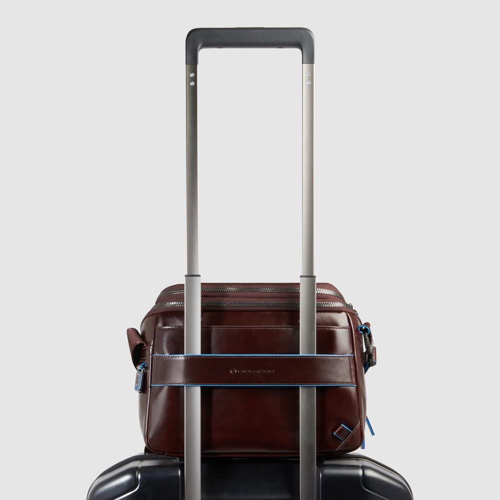 Customizable crossbody bag for iPad® mini with pockets for mouse and airpods and RFID protection. PIQUADRO Brown