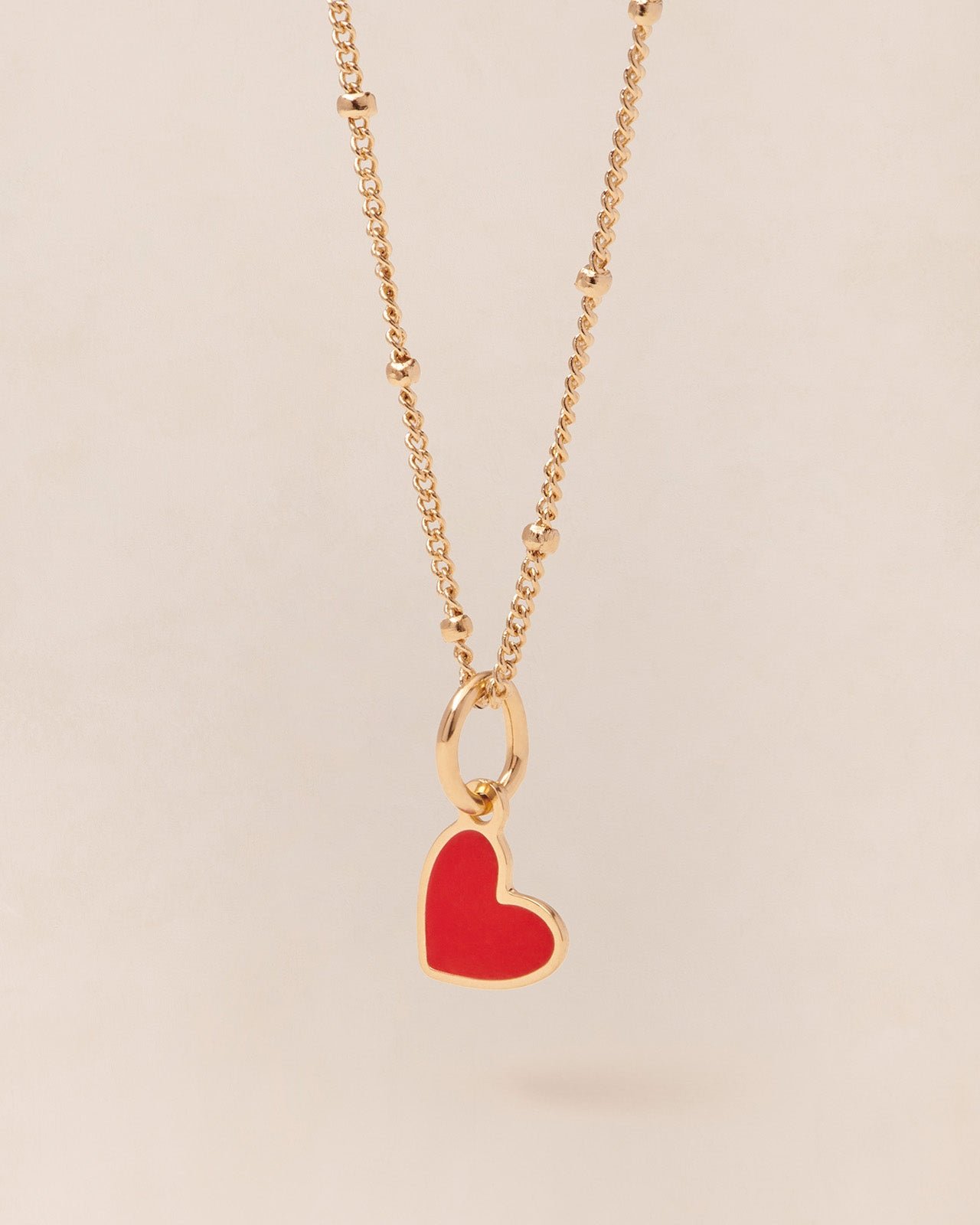 The small heart-shaped pendant in colorful and 24-carat fine gold EMOI EMOI Red