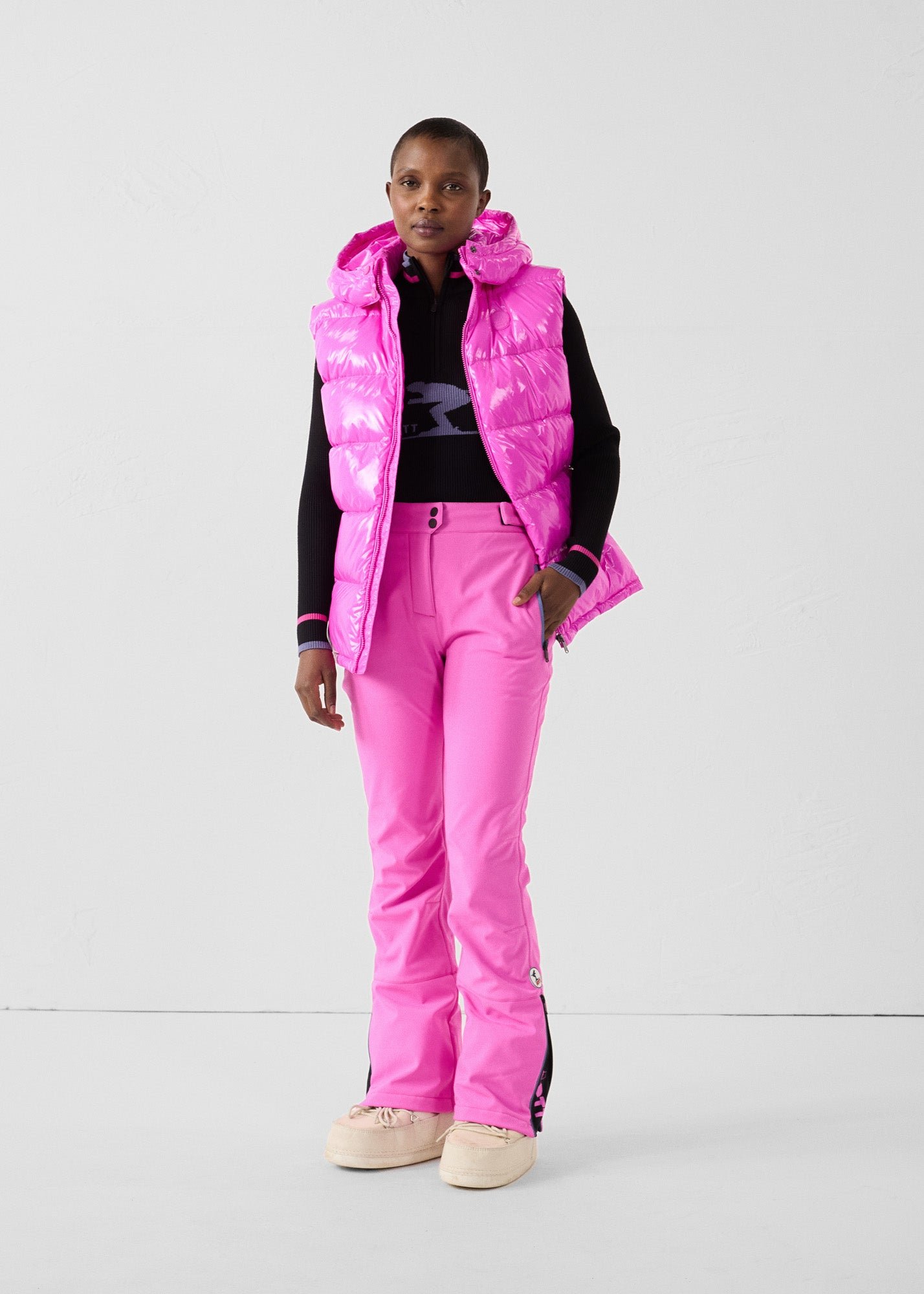 Padded sleeveless down jacket for extreme cold weather. JOTT Pink