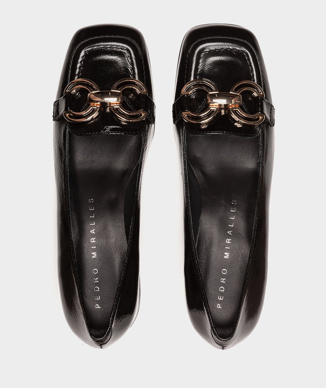 Black high heel shoes with metallic ornament. PEDRO MIRALLES Black