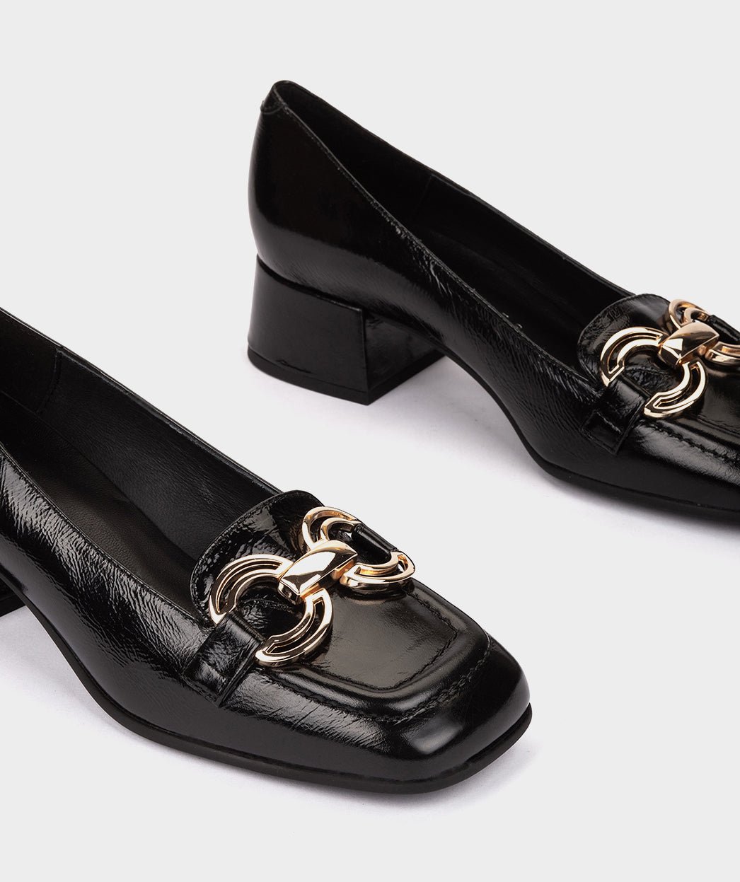 Black high heel shoes with metallic ornament. PEDRO MIRALLES Black