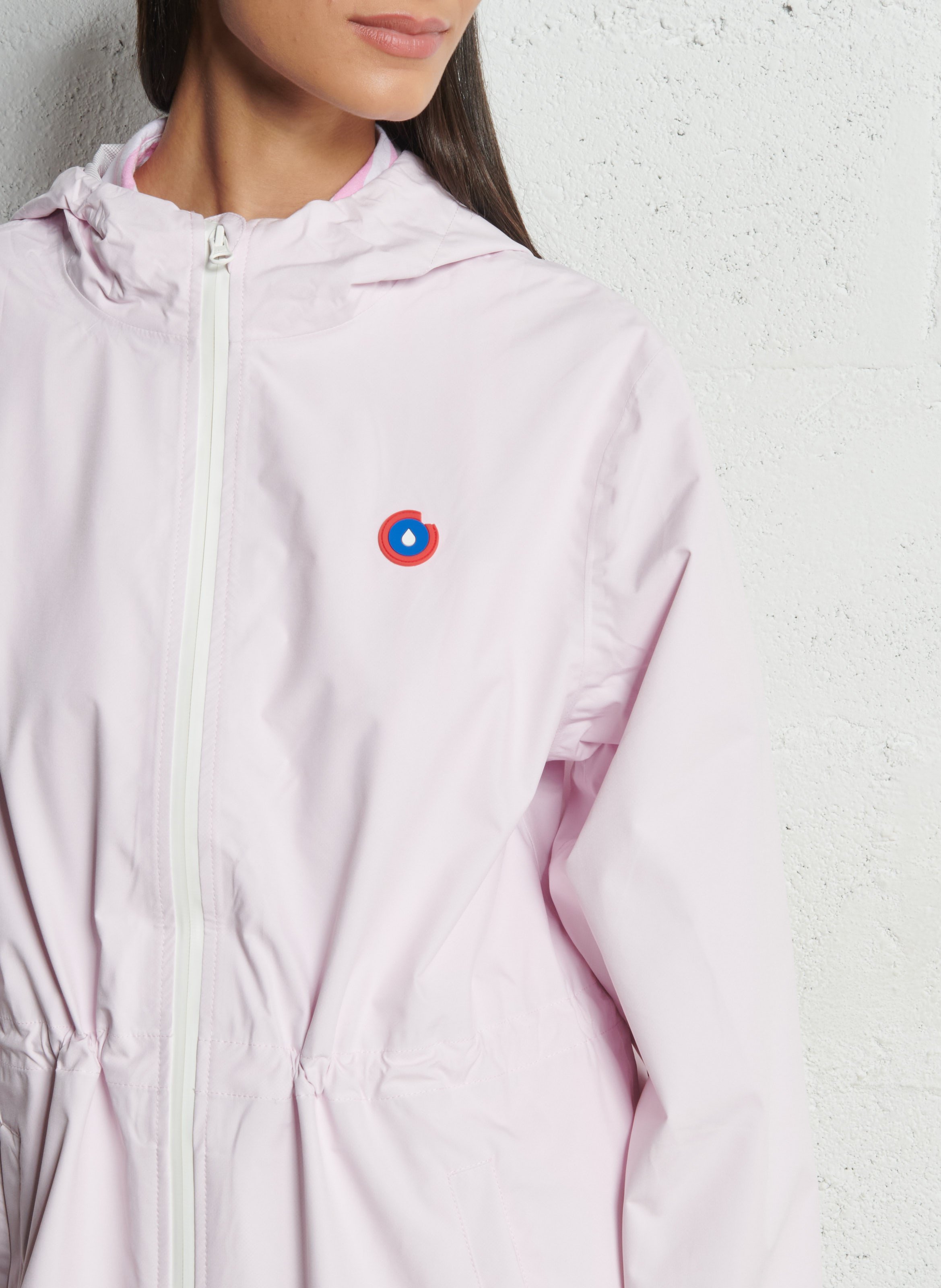 Lange regenjas met capuchon, om te vormen tot rugzakje FLOTTE Roze