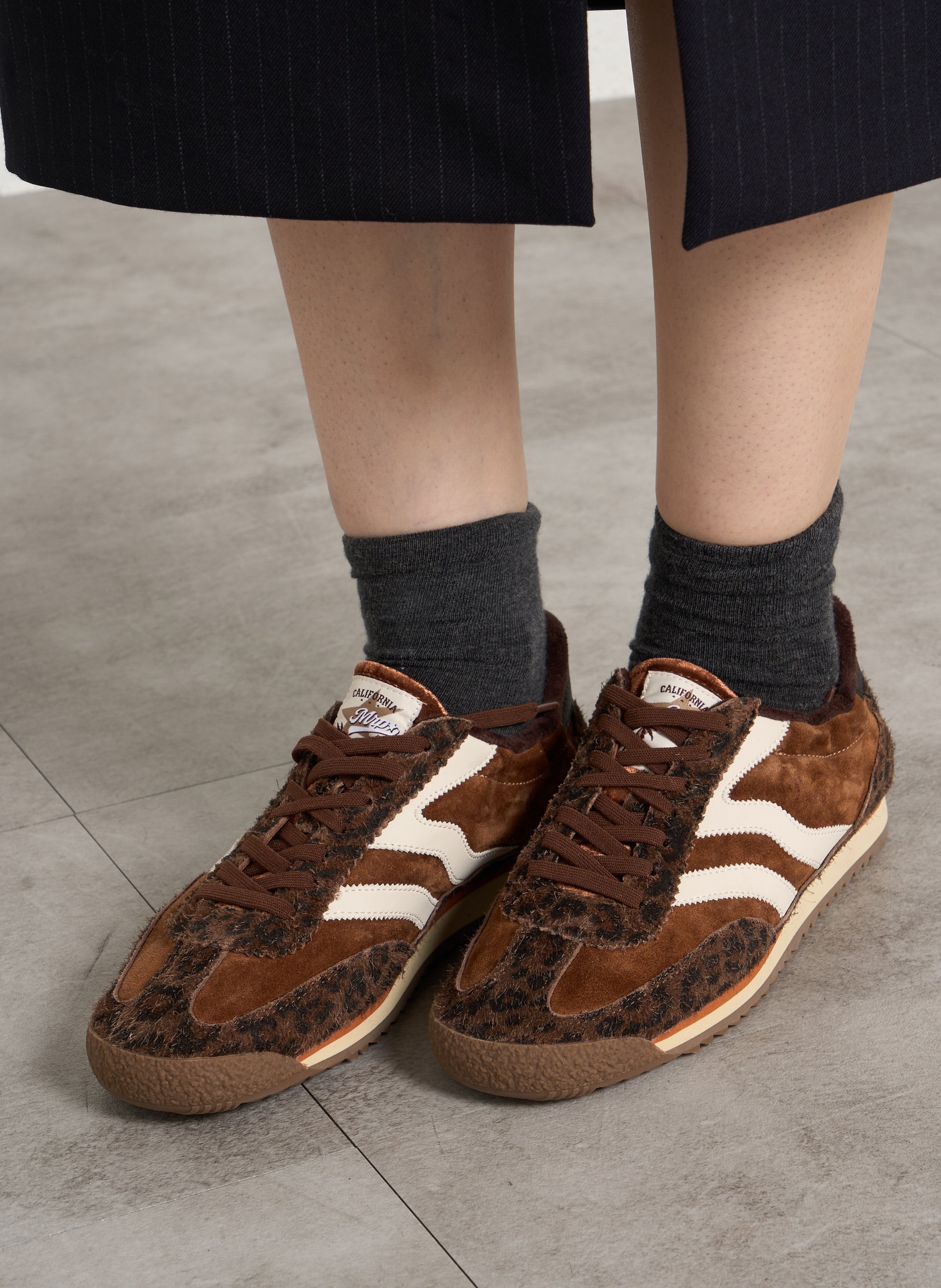 Low-top sneakers with animal print in leather. MRP Brown