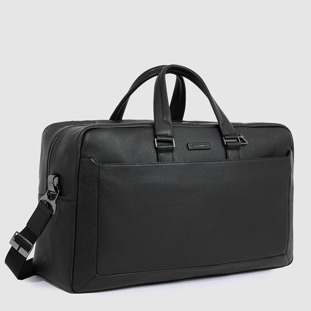 Leather travel bag with shoe compartment and trolley strap. Black