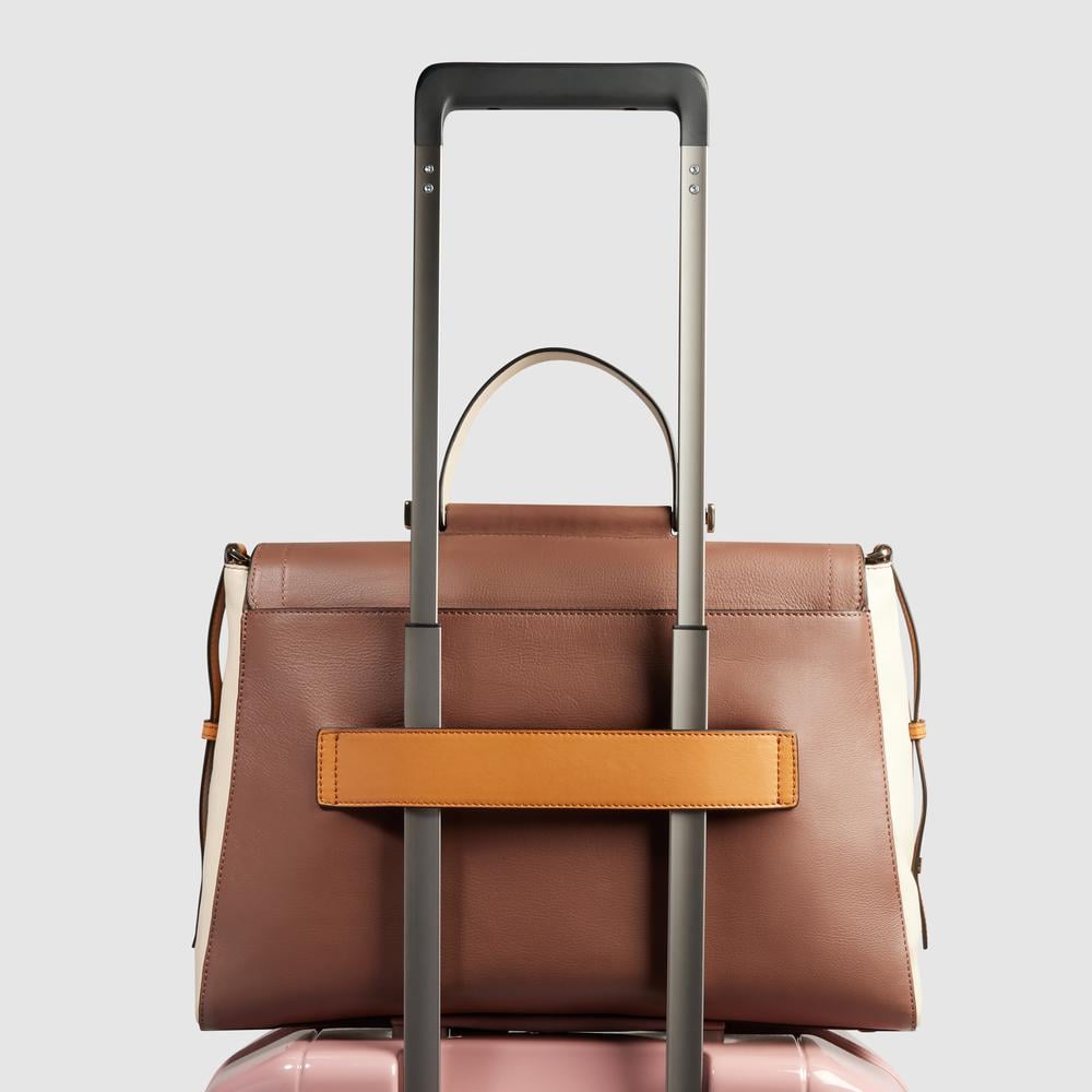 Women's leather satchel bag with laptop compartment, shockproof protection, and RFID shielding PIQUADRO Brown