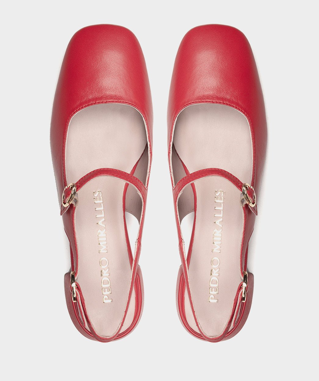 <p>High-heeled red leather shoes, with an open back.</p> PEDRO MIRALLES Red