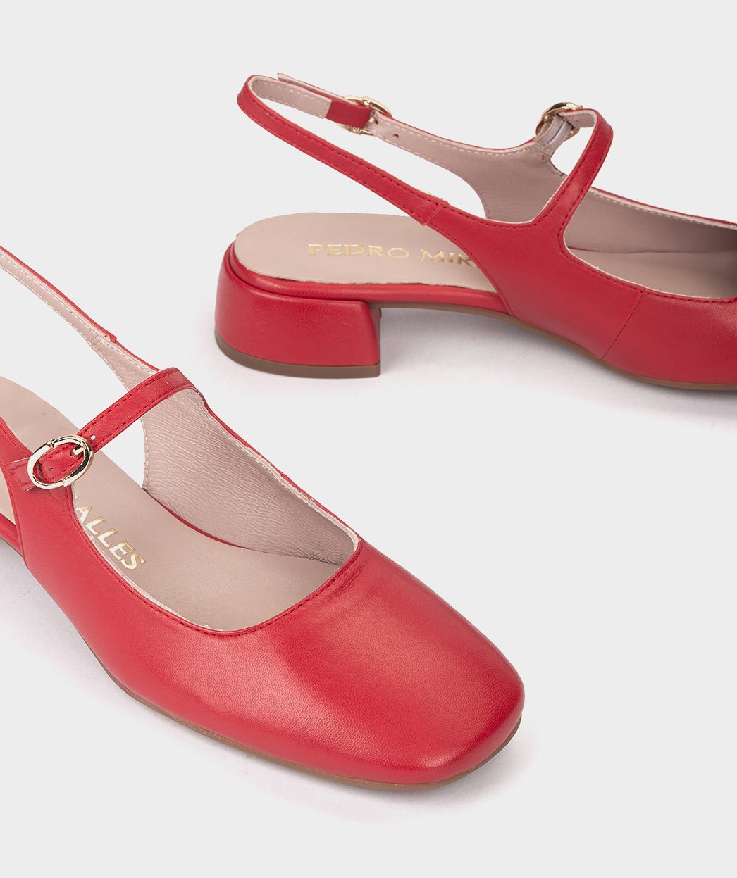 <p>High-heeled red leather shoes, with an open back.</p> PEDRO MIRALLES Red