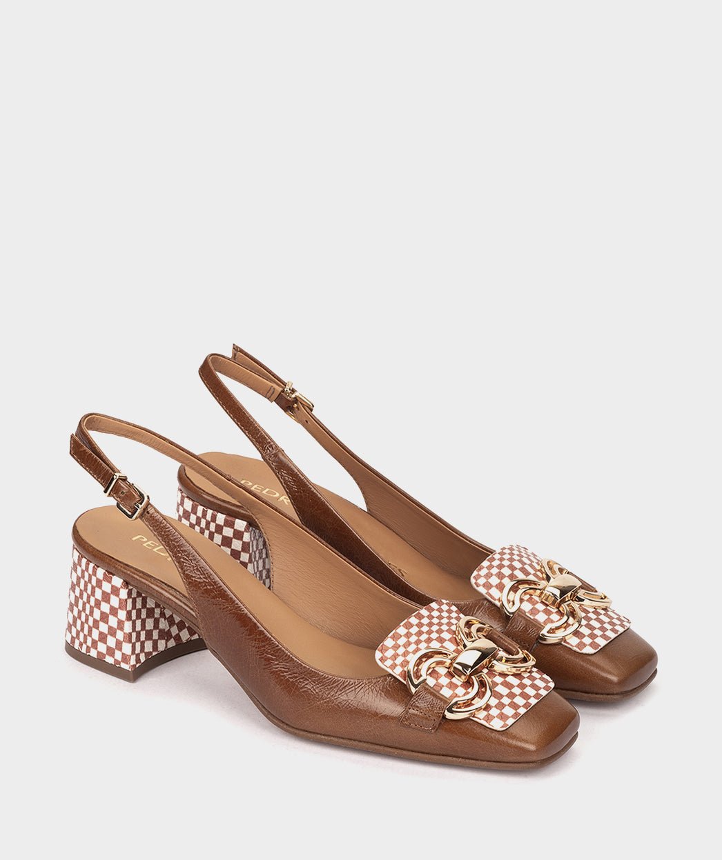 <p>High-heeled brown patent leather shoes, with an open back.</p> PEDRO MIRALLES Brown